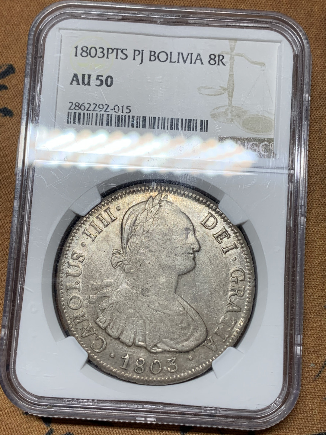 《竞宝斋》钱币微拍-第15场-本周日，周一2场连拍（全场顺丰包邮） NGC-AU50 原味 1803年 西属玻利维亚  卡四 老双柱8R大银币