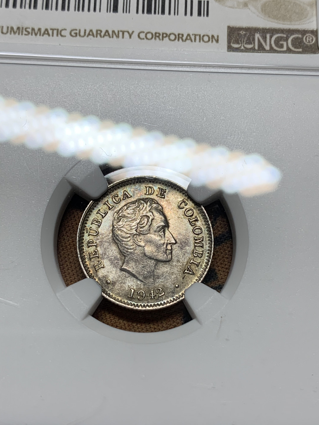 《竞宝斋》钱币微拍-第15场-本周日，周一2场连拍（全场顺丰包邮） NGC-AU58 玻利维亚 1942 年  10分 银币 小而精 细节保存的非常好