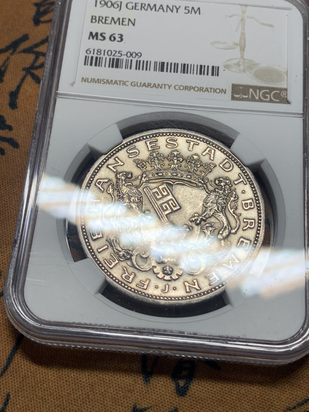 《竞宝斋》钱币微拍-第15场-本周日，周一2场连拍（全场顺丰包邮） NGC-MS63  德国不莱梅 1906-J年 双狮盾徽 5马克 银币 转光带彩 一流的品相味道
