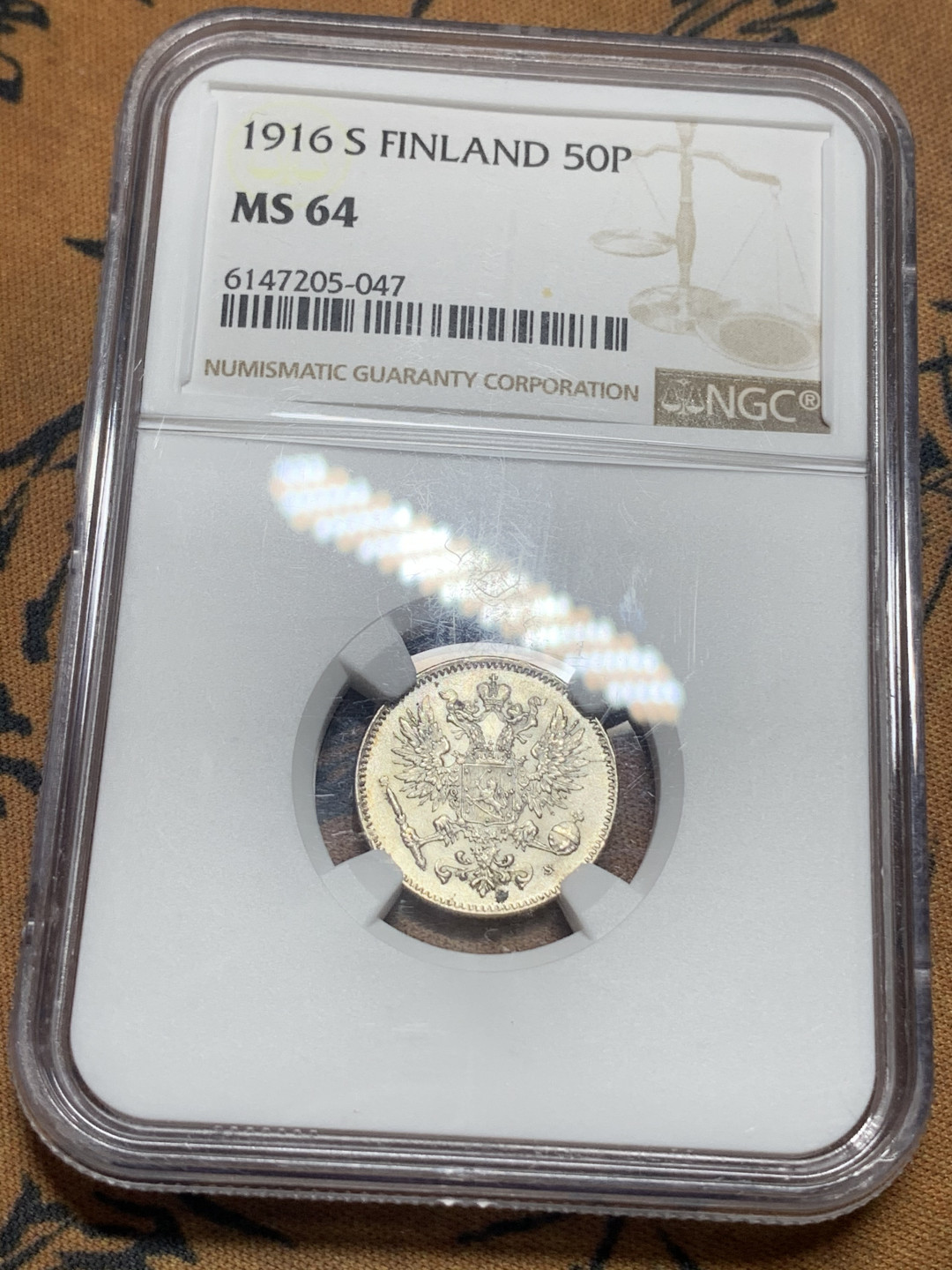 《竞宝斋》钱币微拍-第16场-本周日，周一2场连拍（全场顺丰包邮） NGC-MS64 俄属芬兰 1916年 50盆尼 银币 正面沙俄双头鹰配芬兰大公盾徽，背面标记面值，卷拆曝光品相