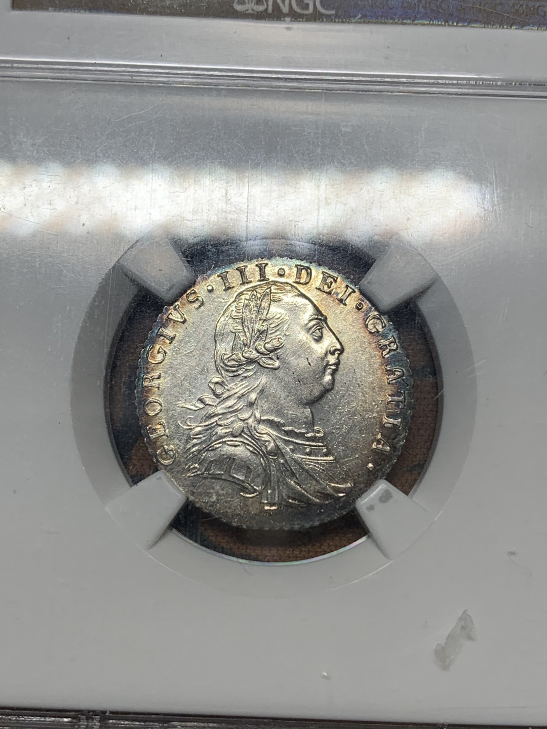 《竞宝斋》钱币微拍-第17场-本周日，周一2场连拍（全场顺丰包邮） NGC-AU58 英国 1787年 乔三 6便士 银币 环彩 细节清晰一流的状态