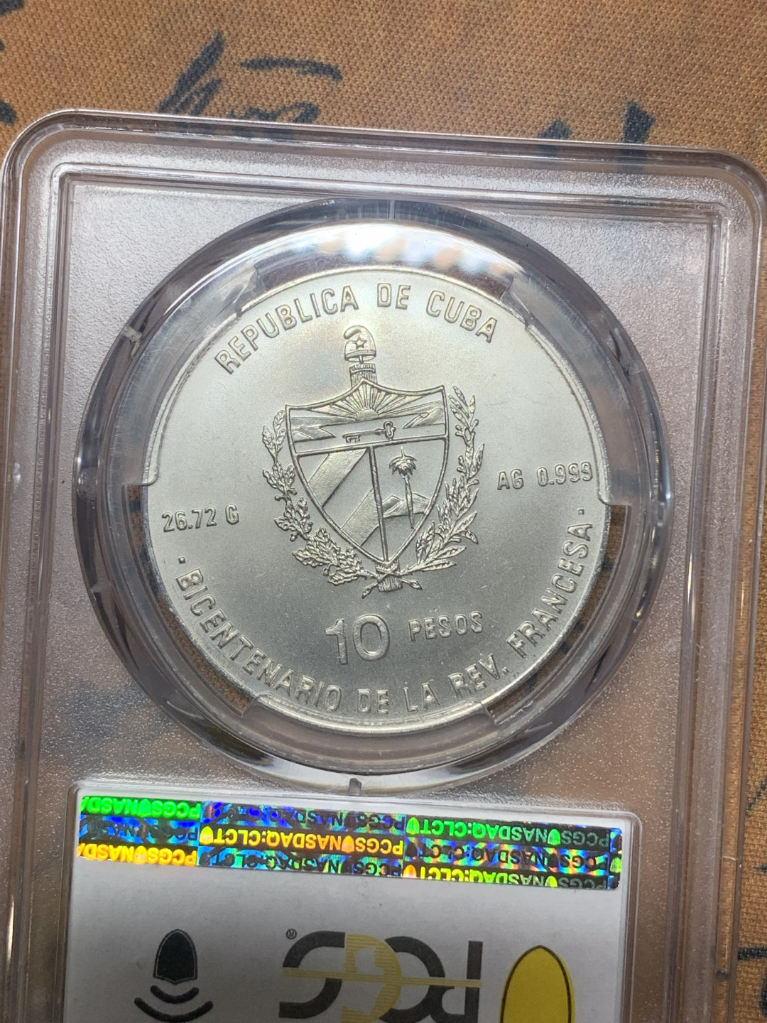 《竞宝斋》钱币微拍-第18场-本周日，周一2场连拍（全场顺丰包邮） PCGS MS65 古巴1989年圣女贞德10比索银币