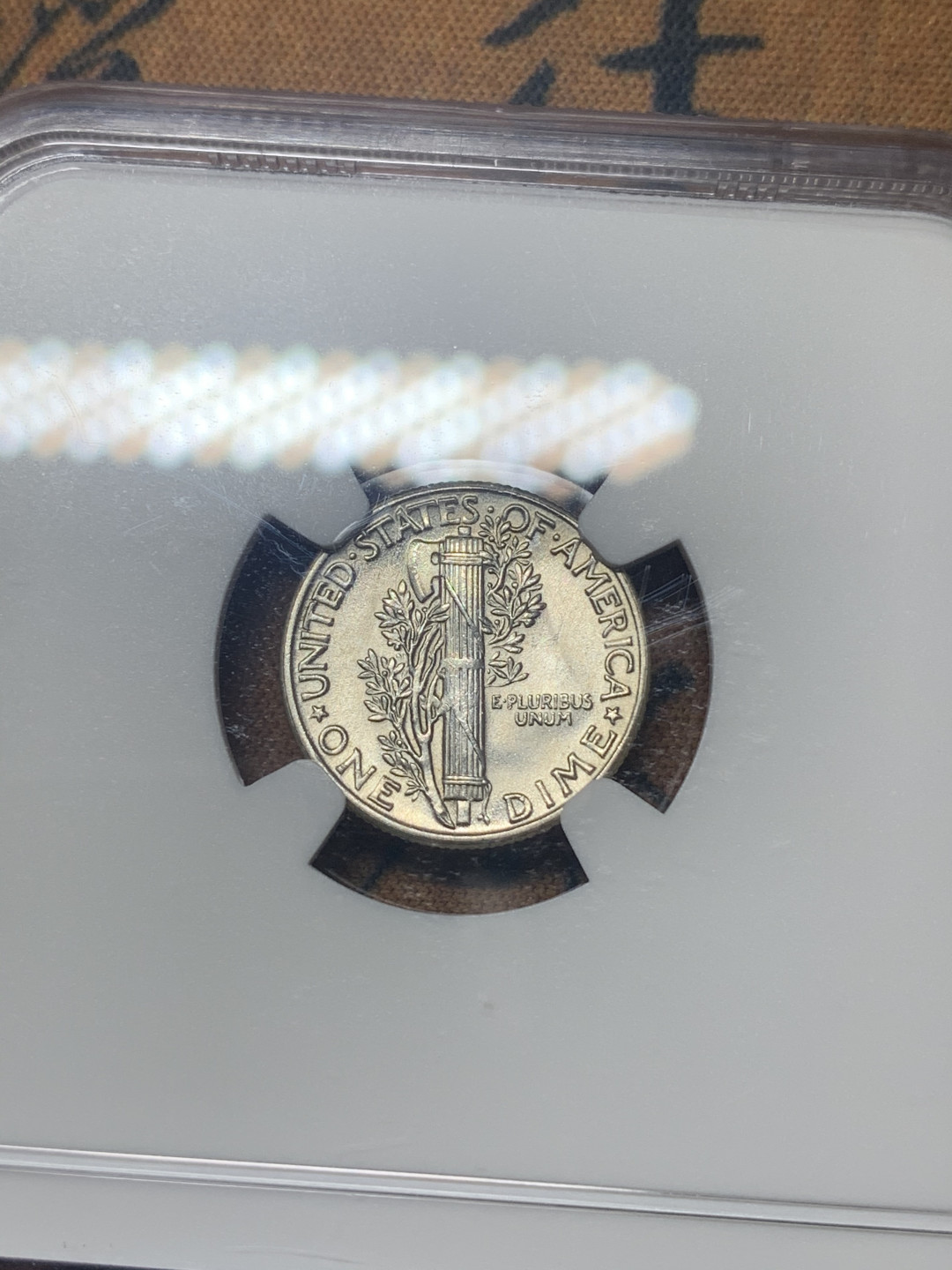 《竞宝斋》钱币微拍-第18场-本周日，周一2场连拍（全场顺丰包邮） NGC-MS65 美国 1945年 墨丘利 小飞侠  10C 银币，细节清晰，头盔上羽翼精细