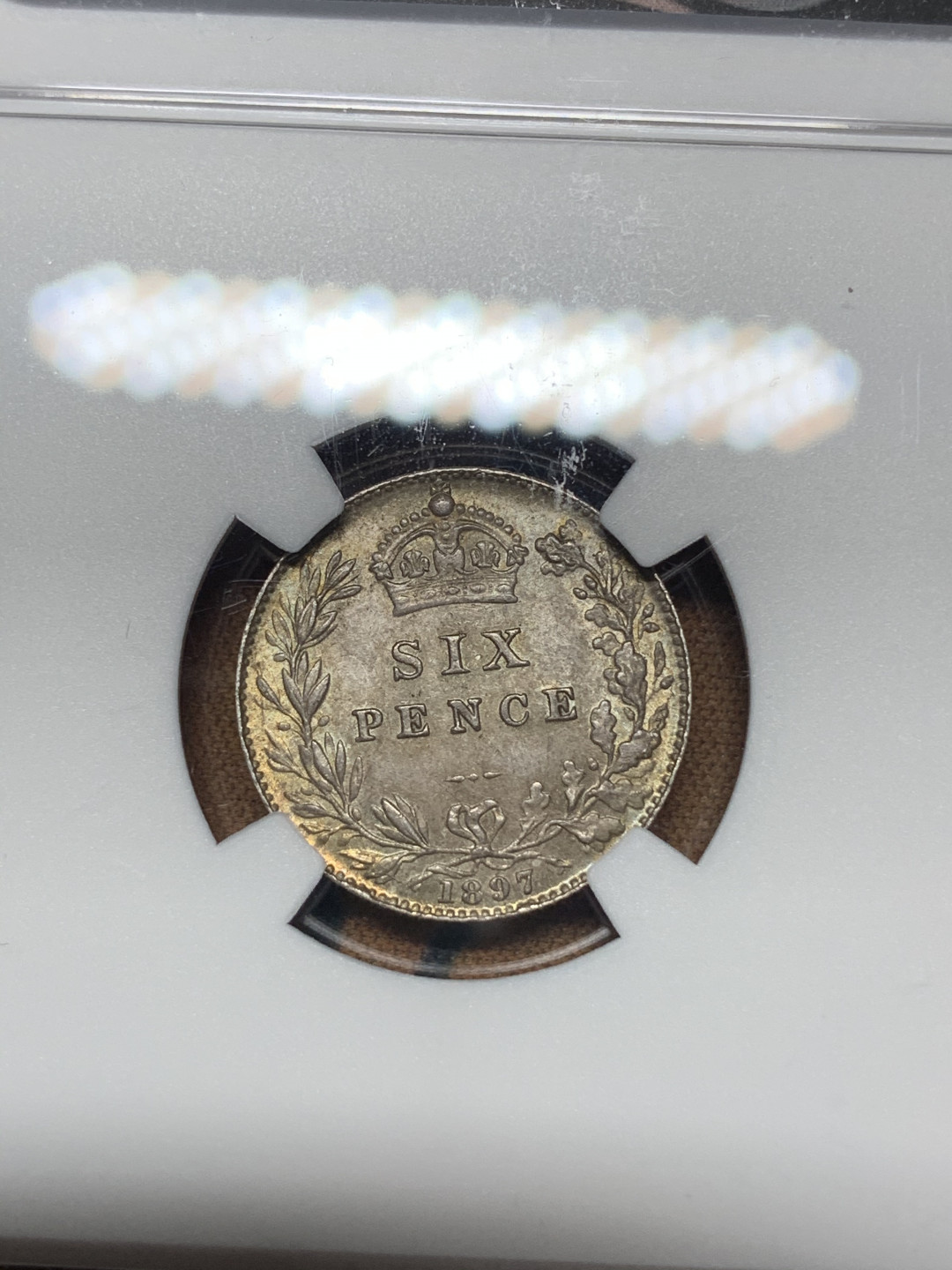 《竞宝斋》钱币微拍-第18场-本周日，周一2场连拍（全场顺丰包邮） NGC MS64 英国1897年6便士 NGC编号：5807938-004 双面五彩