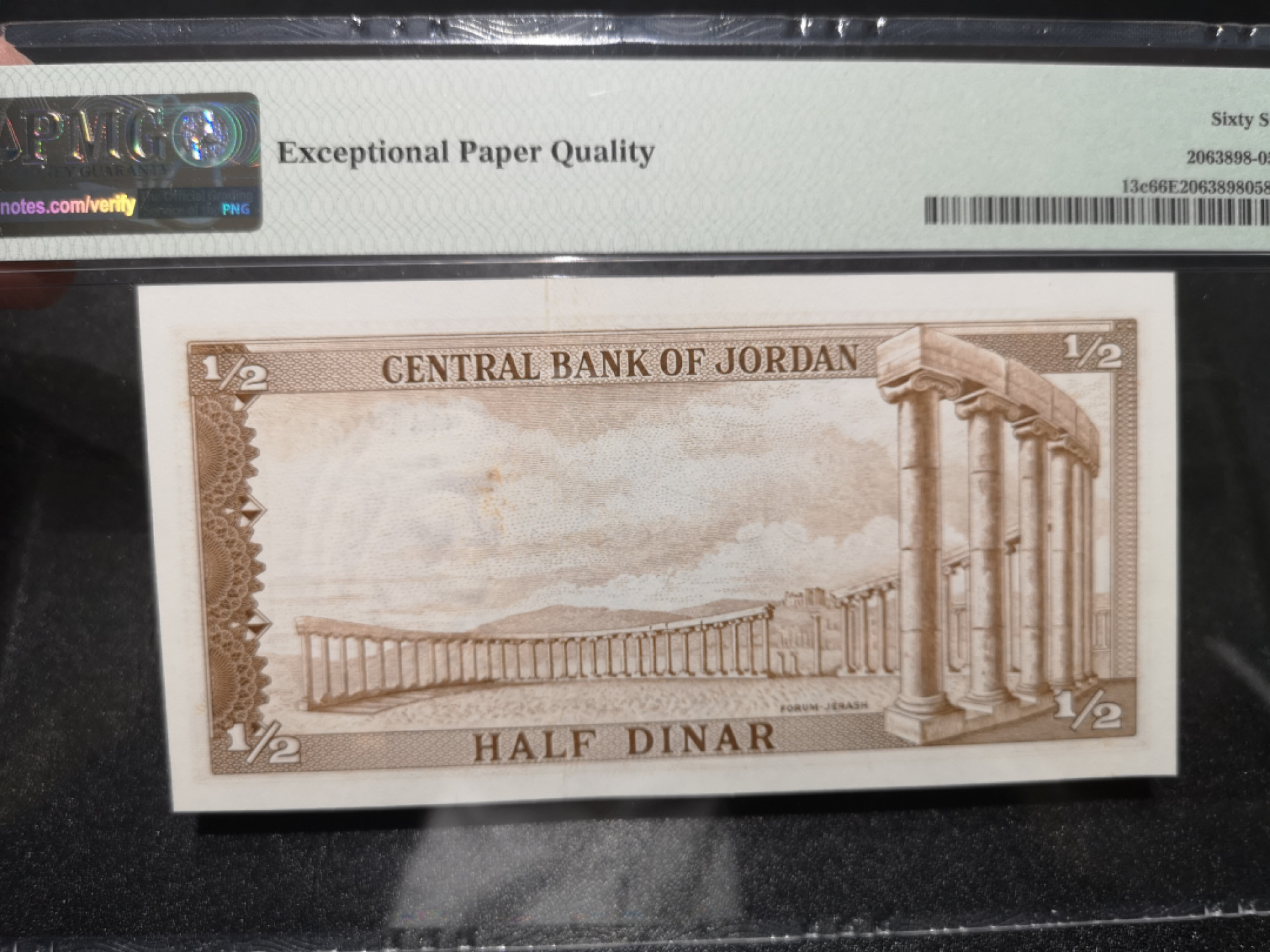 《外钞收藏家》第一百五十二期拍卖（本期98件） 1958年约旦1/2第纳尔 PMG66 无47尾8