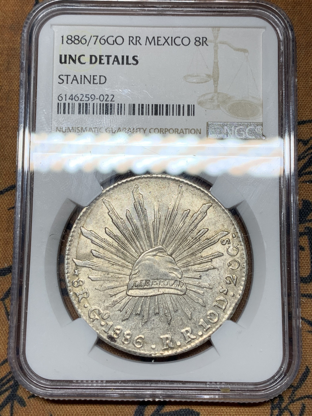 《竞宝斋》钱币微拍-第21场-本周日，周一2场连拍（全场顺丰包邮） NGC-UNCD  墨西哥 1886/76年 8 里亚尔  瓜纳华托厂  银币      淡彩 骑字GO老鹰 