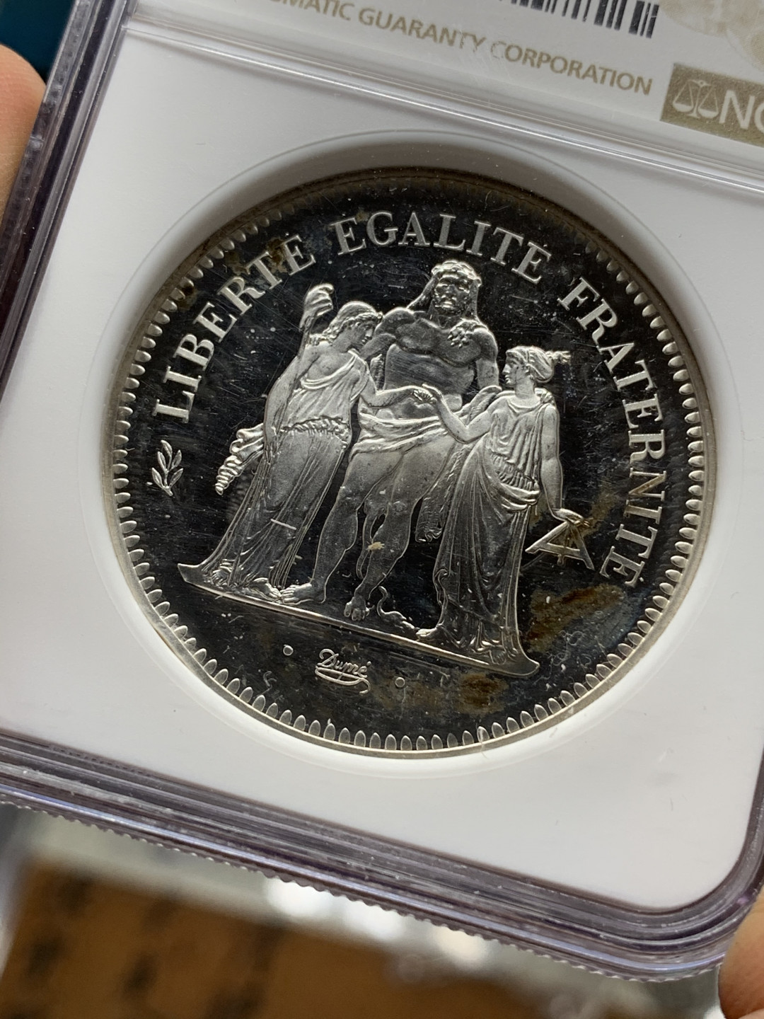 《竞宝斋》钱币微拍-第21场-本周日，周一2场连拍（全场顺丰包邮） NGC-PROOFD 法国1976年大力神 加厚(PIEFORT) 50法郎 大银币 精制PROOF 非常稀少