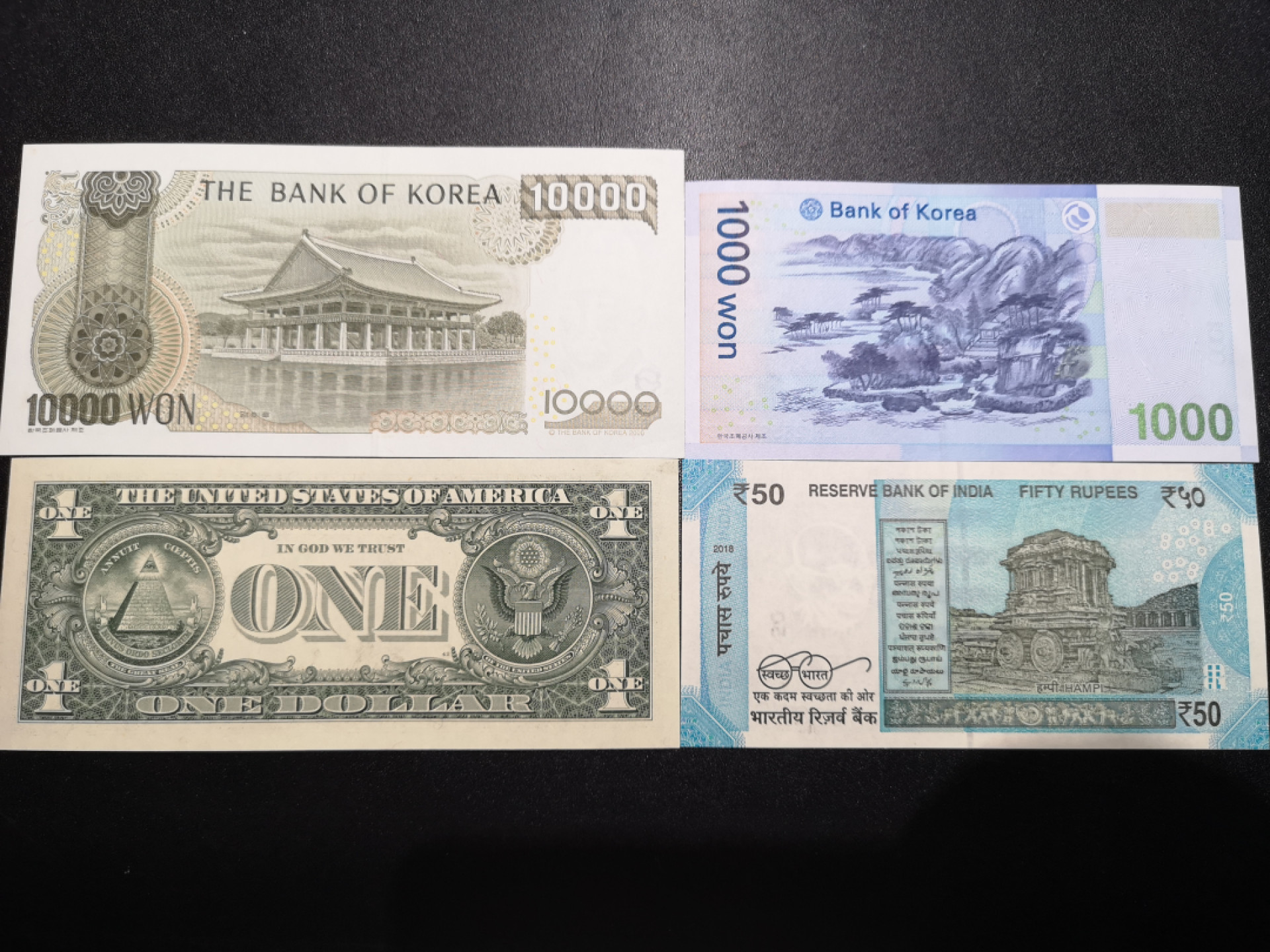 《外钞收藏家》第一百五十七期拍卖（本期62件）（连拍场） 韩元1万、1000韩元777豹子号、美元狮子号、印度888豹子 全新UNC