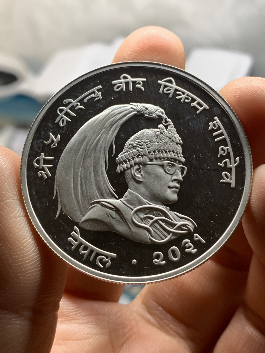 《竞宝斋》钱币微拍-第23场（全场顺丰包邮） 尼泊尔1974年25卢比、50卢比精制大银币一对 925银，重量分别为28.28g、35g，直径分别为38.61mm、42mm，发行量1万1千枚/1万枚。图案主题：珍稀动物野鸡/珍稀动物红熊猫。