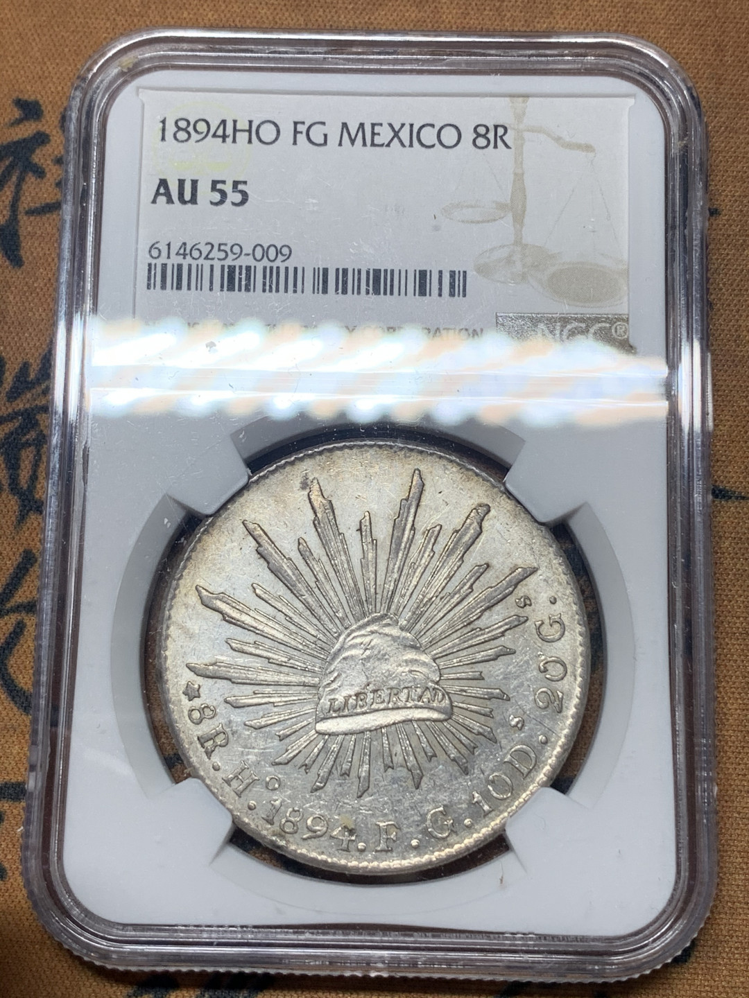 《竞宝斋》钱币微拍-第23场（全场顺丰包邮） NGC-AU55  墨西哥 1894年 8 里亚尔  埃西莫约厂  银币     原味带彩HO厂老鹰