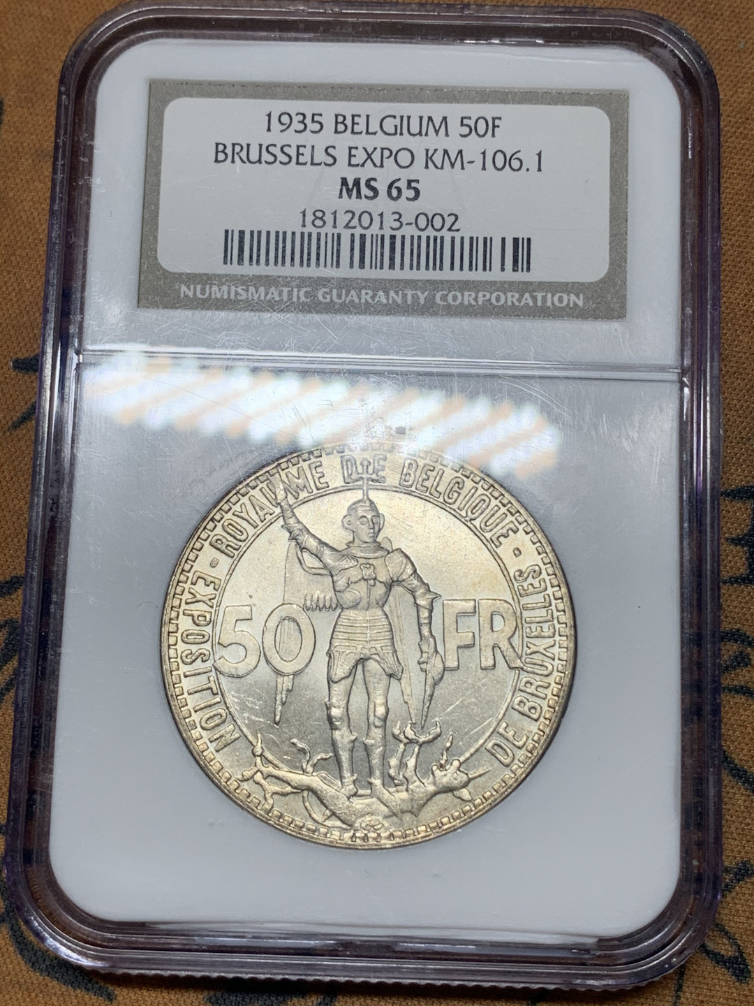 《竞宝斋》钱币微拍-第23场（全场顺丰包邮） ngc-ms65 1935年比利时50法郎 布鲁塞尔世博会 90年的ngc小面包盒严评 新生代天使屠龙 淡金色包浆 原光大银 光泽极佳