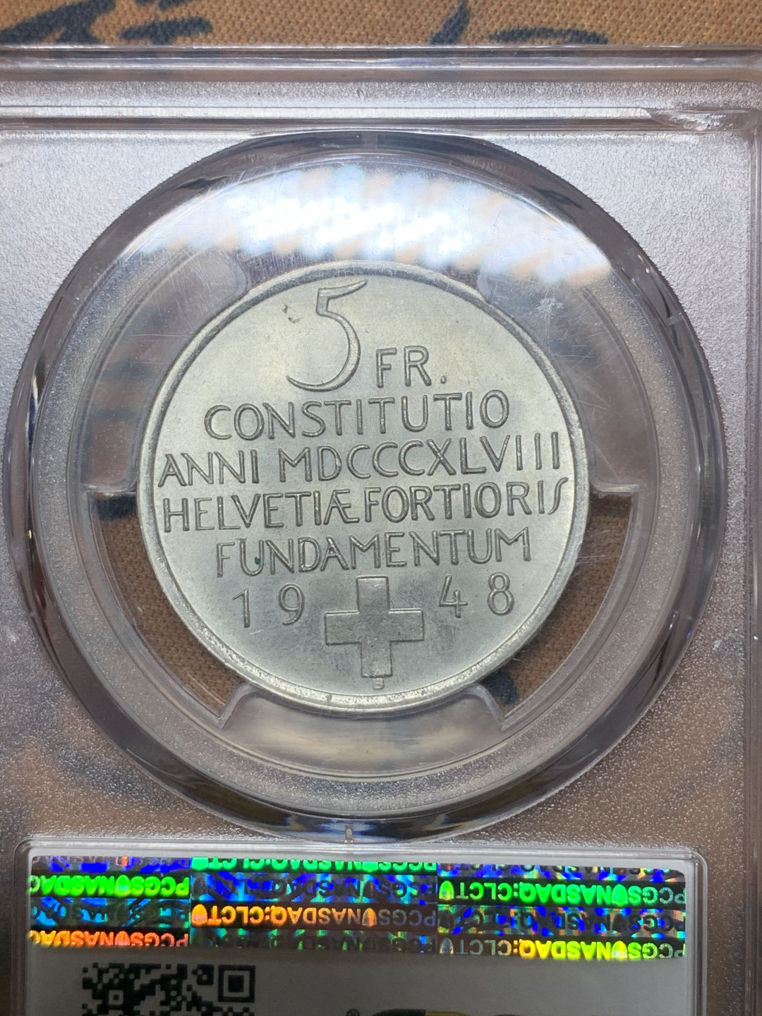 《竞宝斋》钱币微拍-第23场（全场顺丰包邮） pcgs-ms65 1948年瑞士5法郎银币 宪法百年纪念 车轮光状态佳 银光四溢 有磨砂感 正面是瑞士女神赫尔维蒂娅的裸体形象 支撑角有损