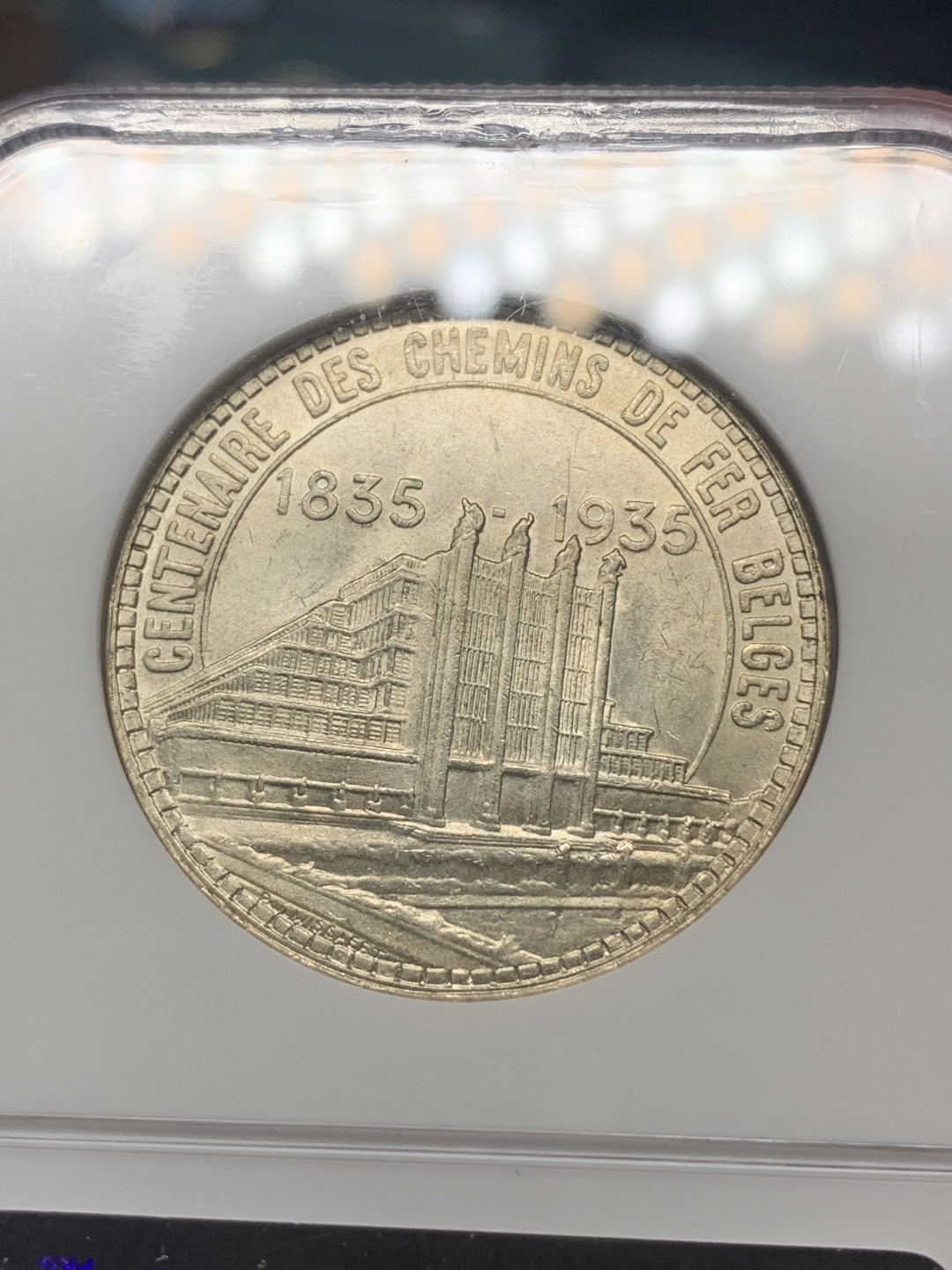 《竞宝斋》钱币微拍-第23场（全场顺丰包邮） ngc-ms65 1935年比利时50法郎 布鲁塞尔世博会 90年的ngc小面包盒严评 新生代天使屠龙 淡金色包浆 原光大银 光泽极佳