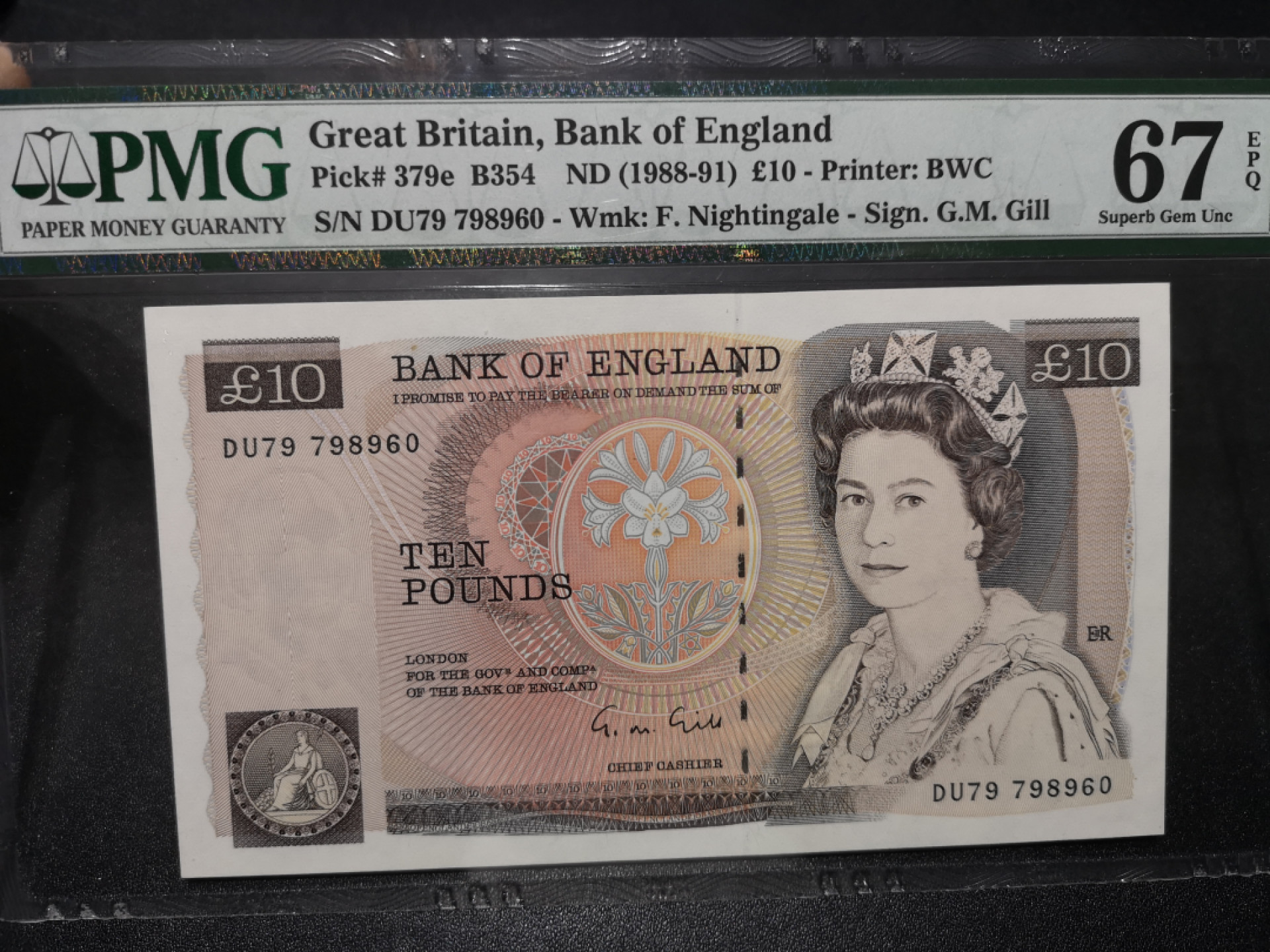 《外钞收藏家》第一百五十八期拍卖（本期111件） 英国D序列10镑 PMG67 BWC版（379e）
