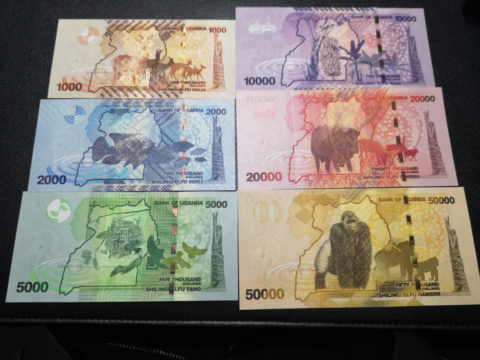 《外钞收藏家》第一百五十八期拍卖（本期111件） 乌干达全套六张 除1万面额 其他都是2010年版 全新UNC