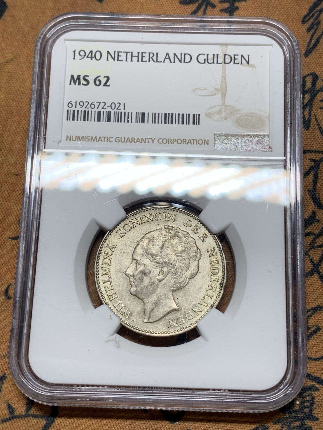 《竞宝斋》钱币微拍-第24场-本周日，周一2场连拍（全场顺丰包邮） NGC-MS62 荷兰 1940年 威廉米娜女王 1盾 银币 原光好品