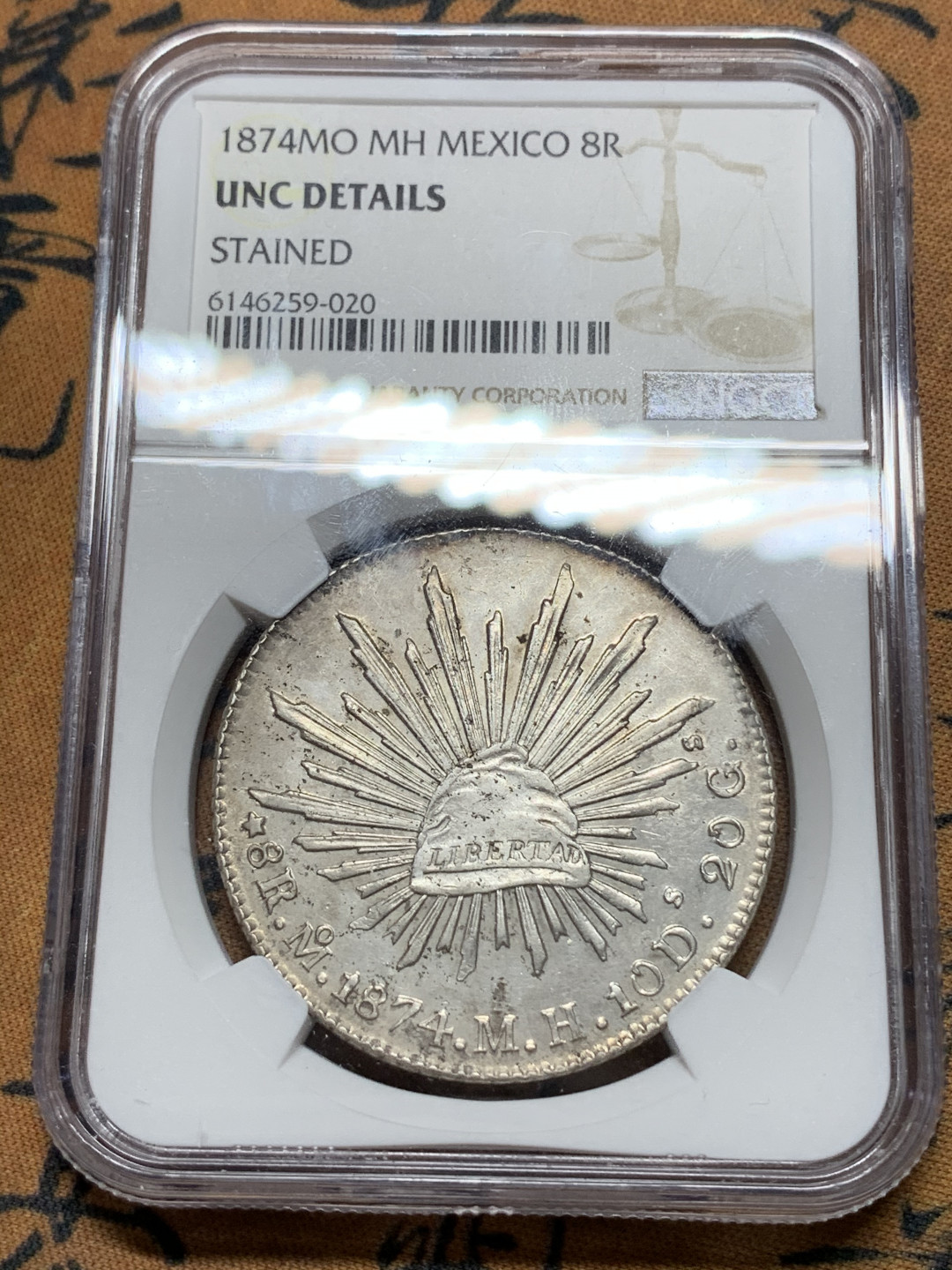 《竞宝斋》钱币微拍-第24场-本周日，周一2场连拍（全场顺丰包邮） NGC-UNCD   墨西哥 1874年 8 里亚尔   墨西哥厂  银币     原味mo厂老鹰 