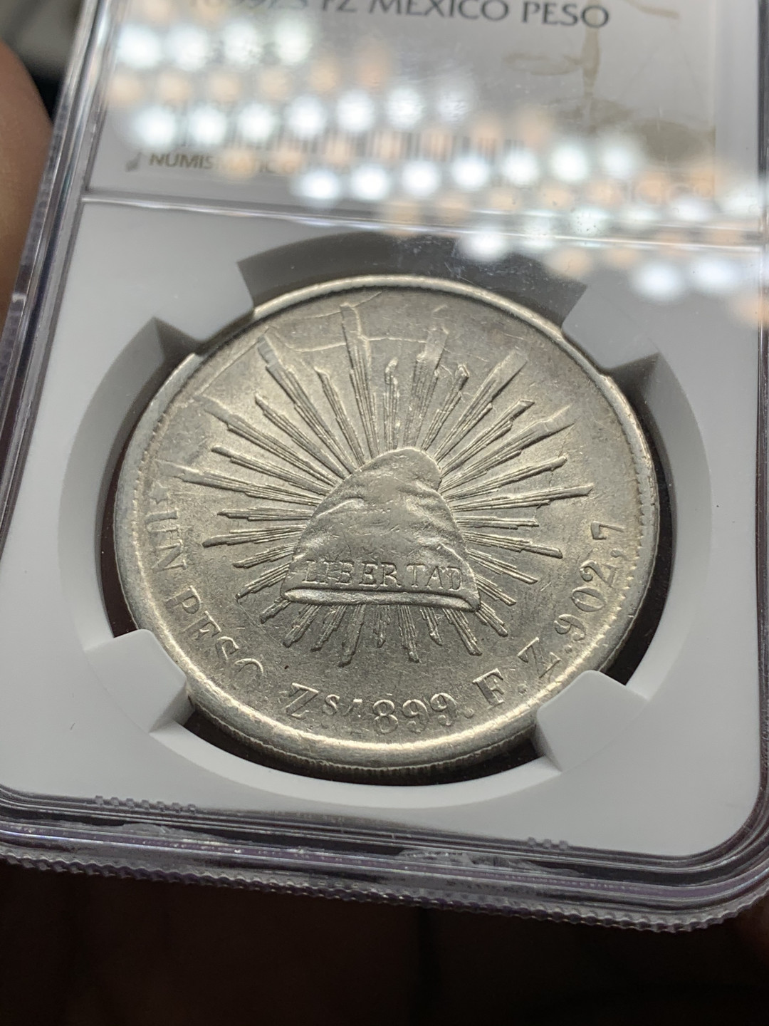 《竞宝斋》钱币微拍-第25场-本周日，周一2场连拍（全场顺丰包邮） NGC AU58 1899墨西哥萨卡特卡斯厂 直边鹰洋全羽原光品相相当漂亮