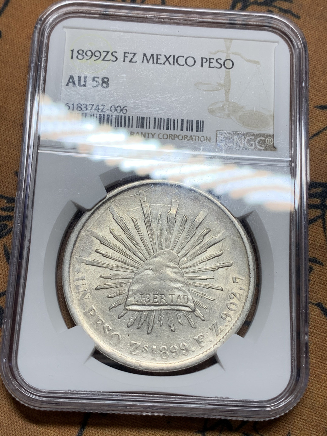 《竞宝斋》钱币微拍-第25场-本周日，周一2场连拍（全场顺丰包邮） NGC AU58 1899墨西哥萨卡特卡斯厂 直边鹰洋全羽原光品相相当漂亮