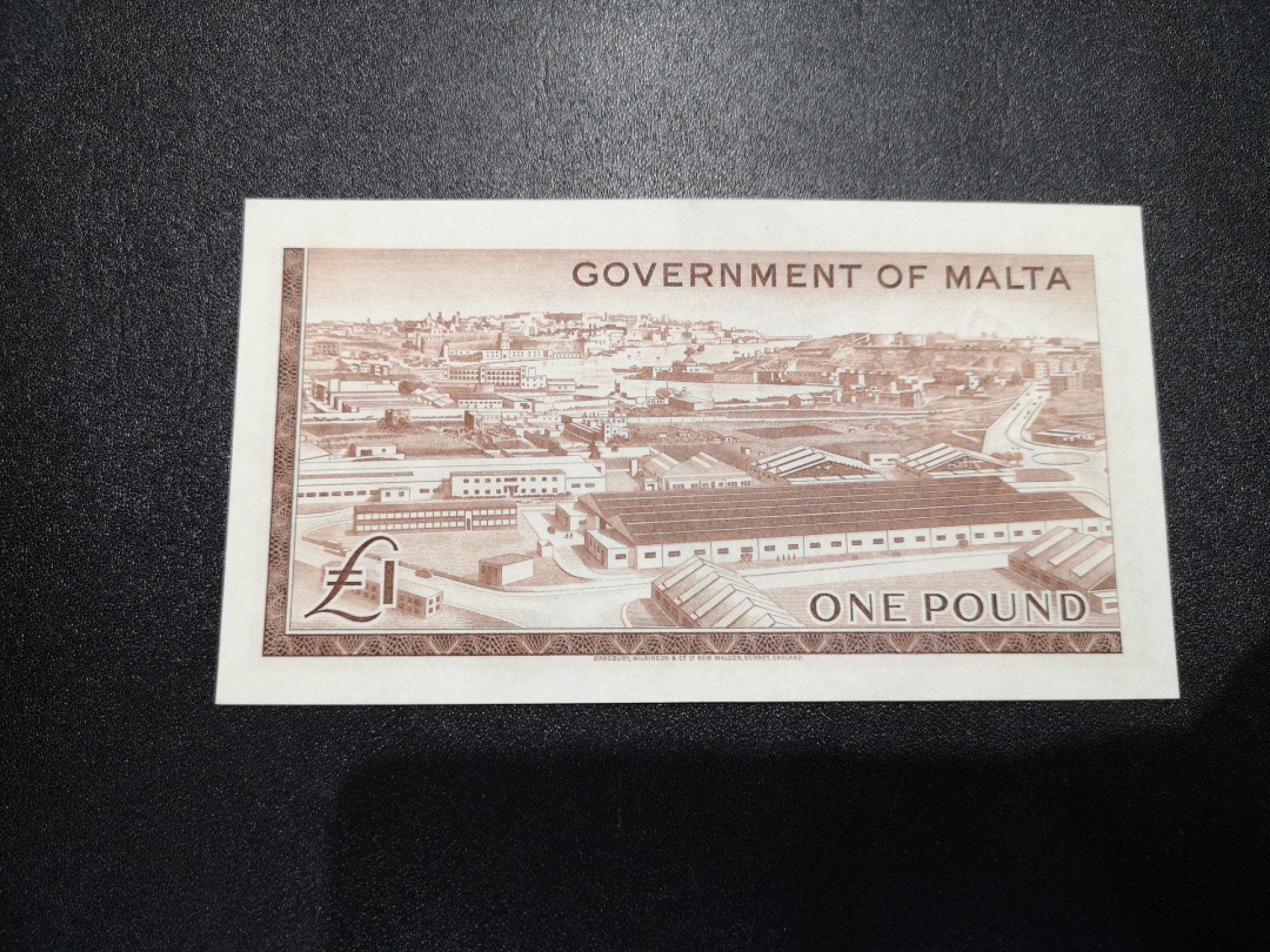 👍2022新年第一拍《外钞收藏家》第一百五十九期拍卖（本期59件） 1949年马耳他1镑 有暗折 AU品相 有星星点潮 不严格检查整体近乎全新