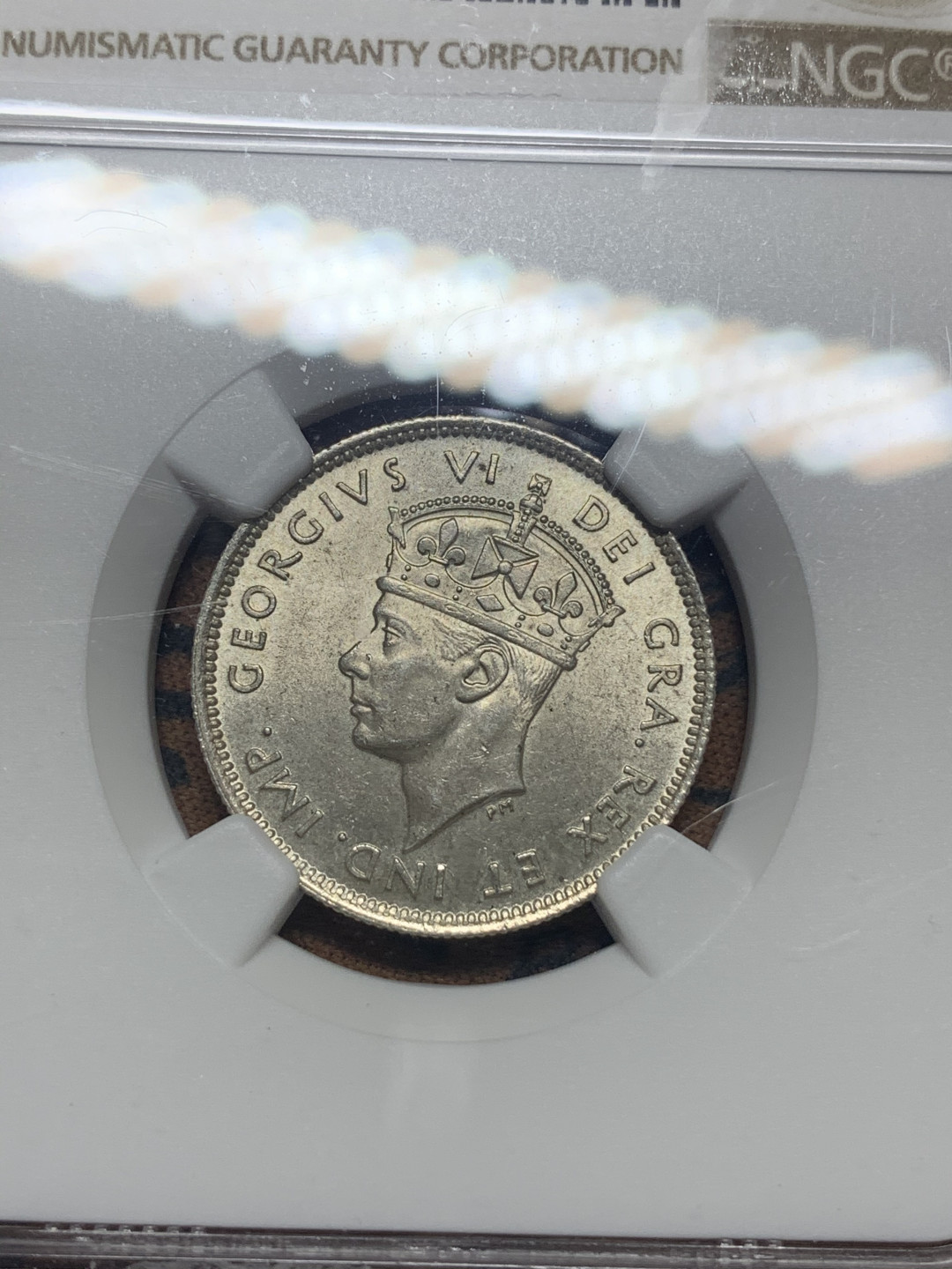 《竞宝斋》钱币微拍-第26场 元旦特刊（全场顺丰包邮） NGC MS63 塞浦路斯 1940年 9P 银币 正面盒子边缘有小缺