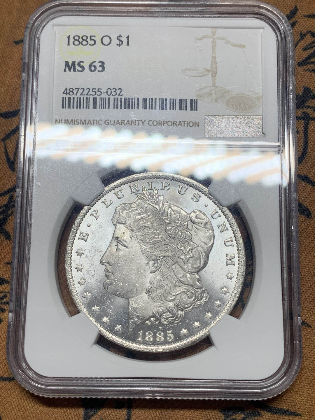 《竞宝斋》钱币微拍-第26场 元旦特刊（全场顺丰包邮） NGC-MS63 美国 1885年 O版 1美元 摩根银币 卷拆原光品相，底板亮晶晶。底板达到镜面的程度了，可以试试砸盒重新送评，可能给PL