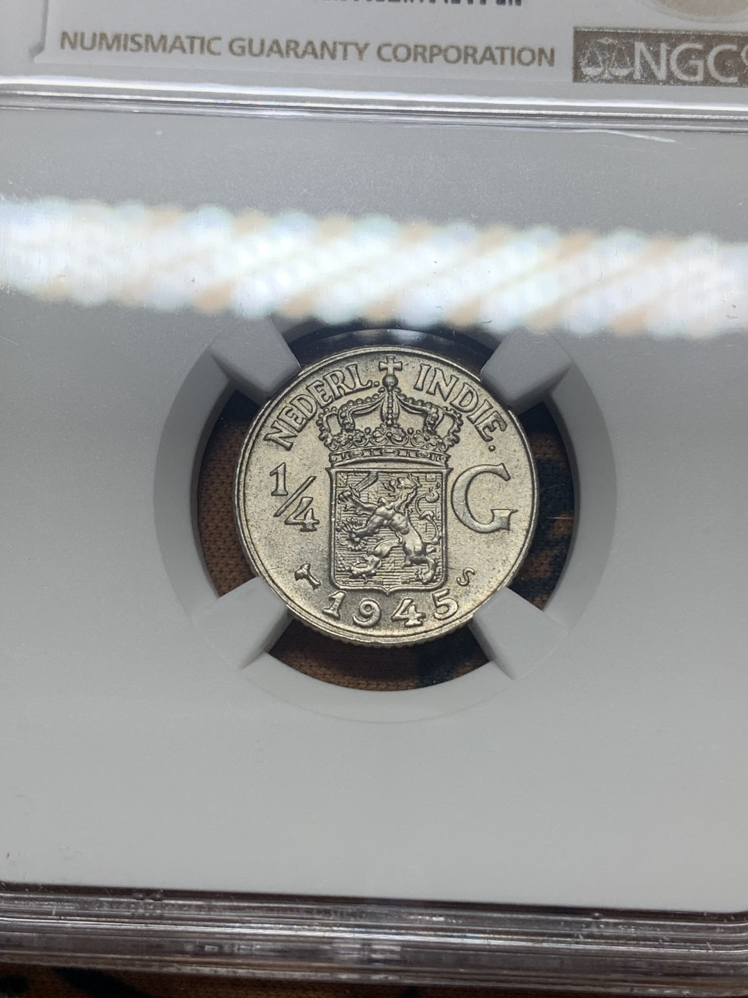 《竞宝斋》钱币微拍-第26场 元旦特刊（全场顺丰包邮） NGC-MS64 荷属东印度 1945-S年 1/4盾 原光顶级品相