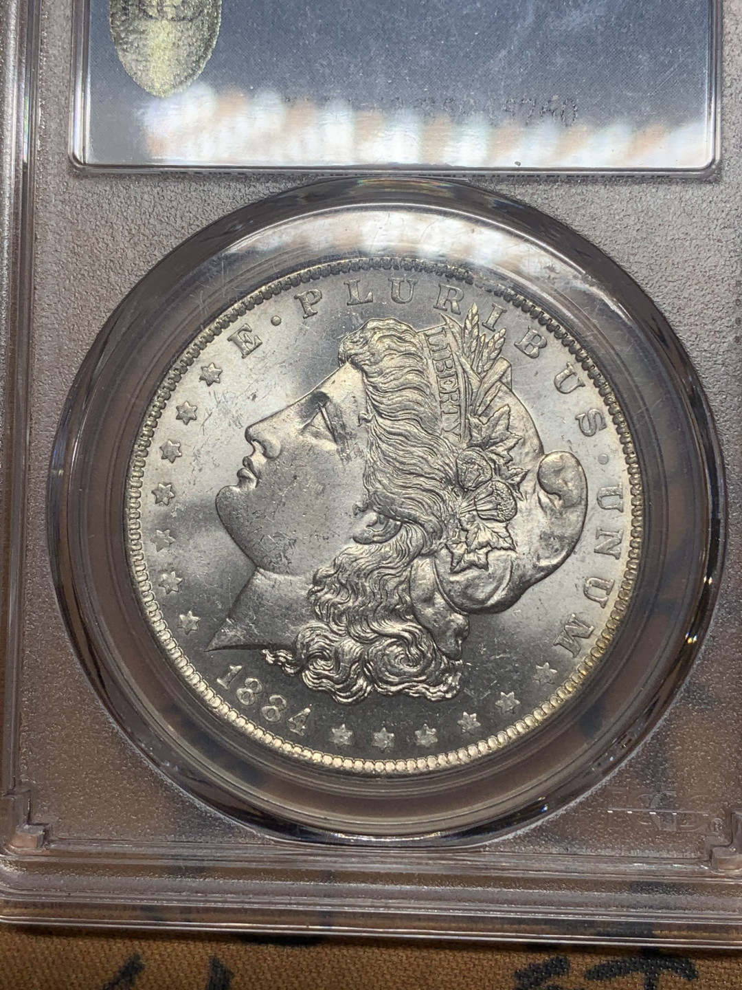 《竞宝斋》第27场-本周日，周一2场连拍（全场顺丰包邮） PCGS-MS63 美国 1884年 O版 1美元 摩根银币 卷拆原光品相，底板亮晶晶，属于63分里状态比较好的币了