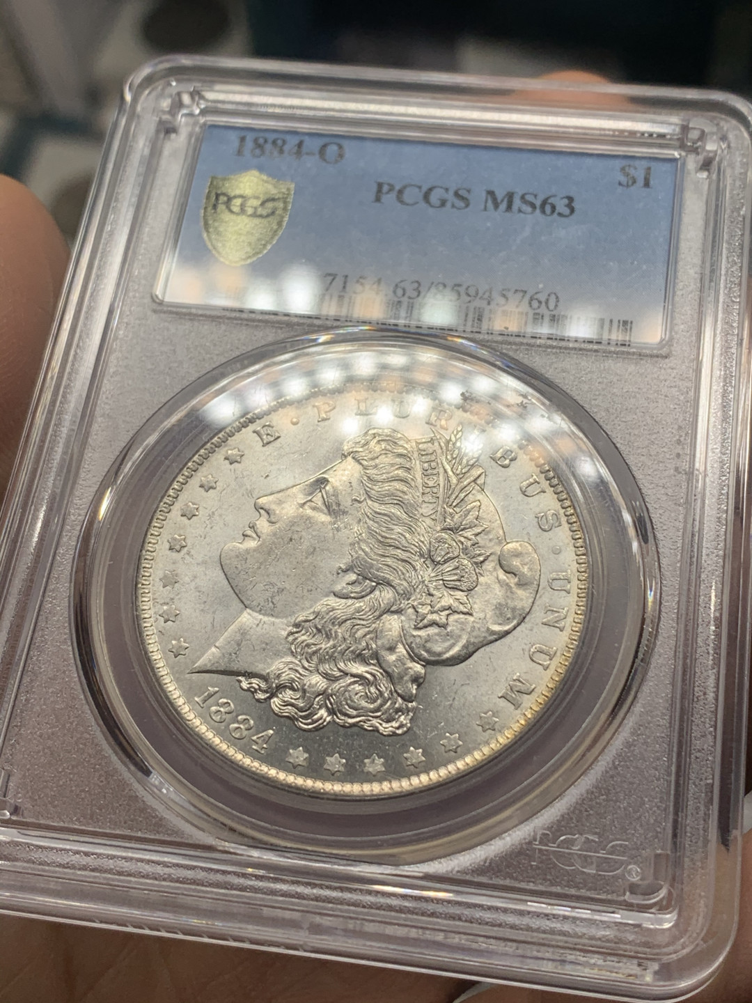 《竞宝斋》第27场-本周日，周一2场连拍（全场顺丰包邮） PCGS-MS63 美国 1884年 O版 1美元 摩根银币 卷拆原光品相，底板亮晶晶，属于63分里状态比较好的币了