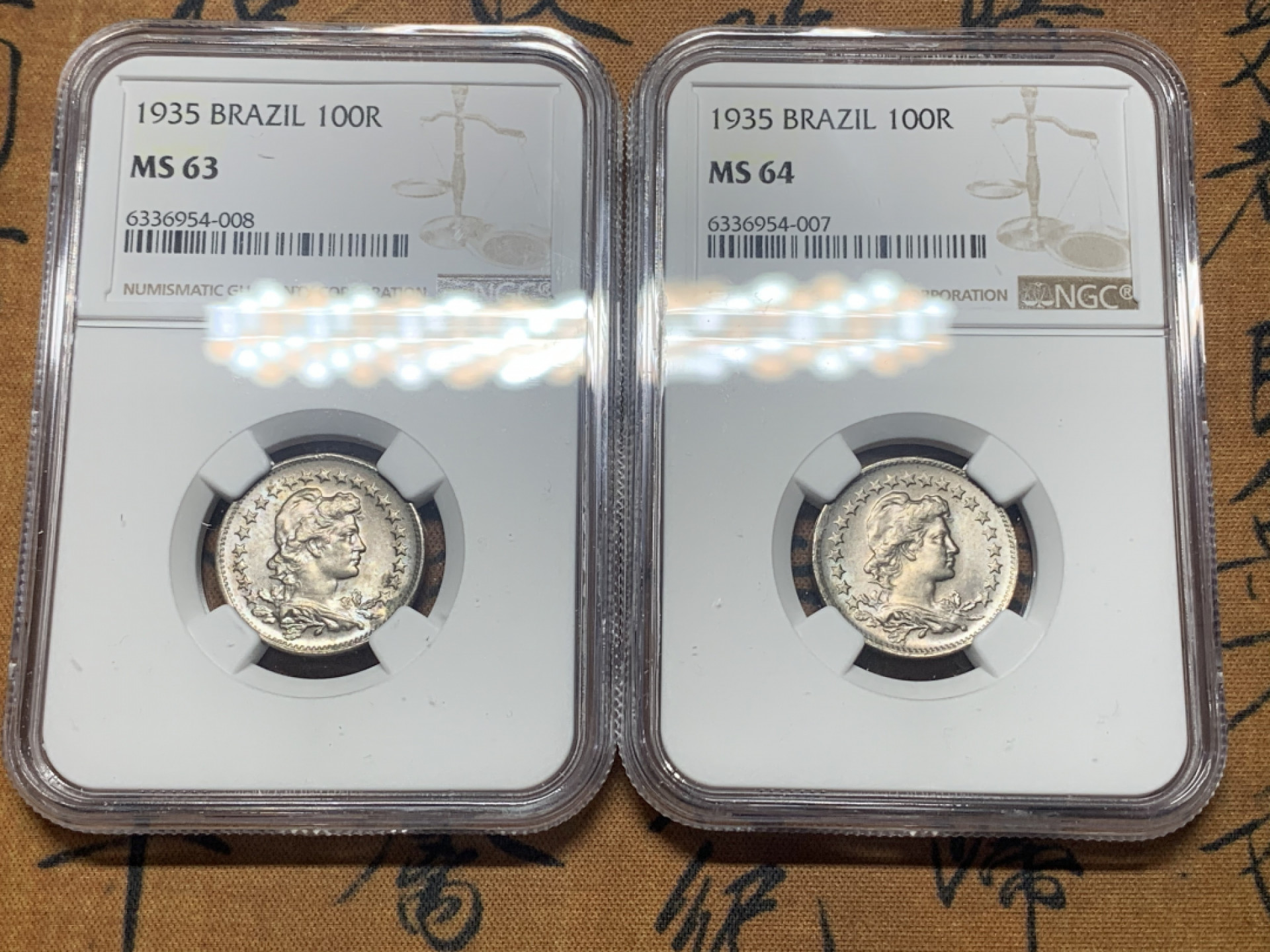 《竞宝斋》第27场-本周日，周一2场连拍（全场顺丰包邮） NGC MS63，64 巴西1935年100r女神镍币一对