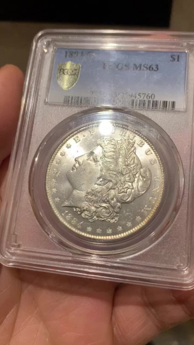 《竞宝斋》第27场-本周日，周一2场连拍（全场顺丰包邮） PCGS-MS63 美国 1884年 O版 1美元 摩根银币 卷拆原光品相，底板亮晶晶，属于63分里状态比较好的币了