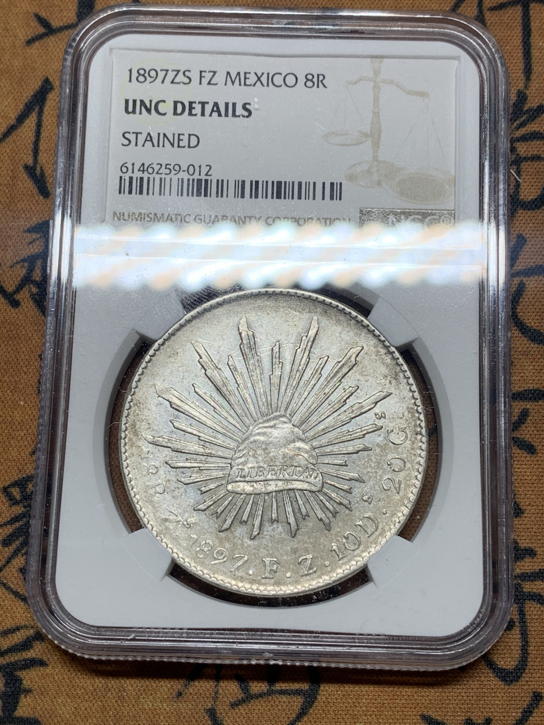 《竞宝斋》第27场-本周日，周一2场连拍（全场顺丰包邮） NGC-UNCD  墨西哥 1897年 8 里亚尔  萨斯特卡斯厂  银币     原味粉光 