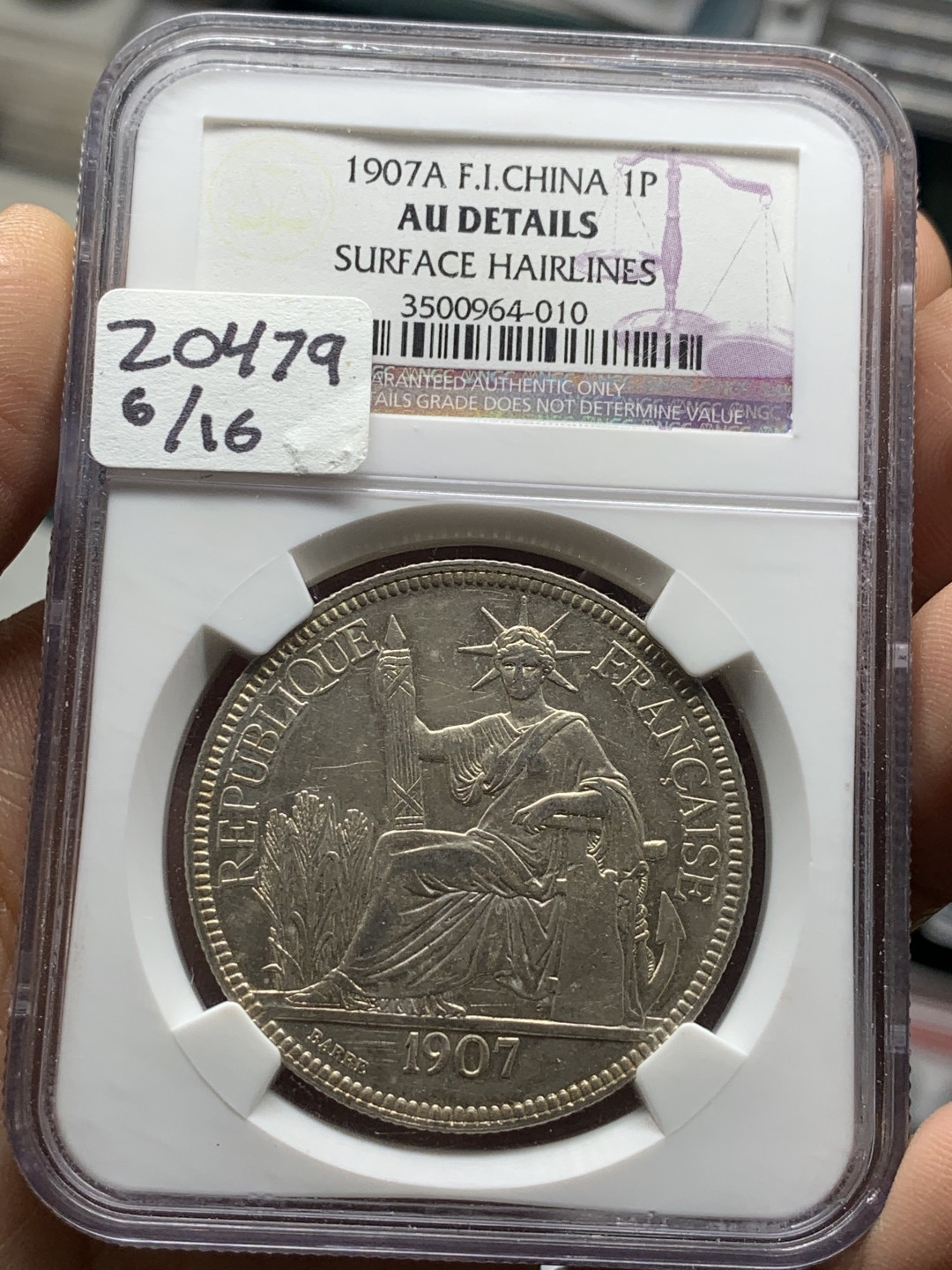 《竞宝斋》第28场-本周日，周一2场连拍（全场顺丰包邮） NGC-AUD92  法属印度支那1907年坐洋银币  全脸高鼻 金彩包浆 状态好