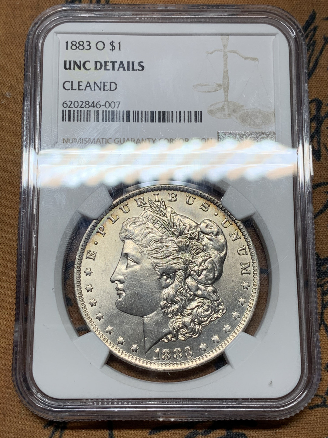 《竞宝斋》第31场（年内尾拍）-周日，周一，周二3场连拍（全场顺丰包邮） NGC-UNCD 美国 1883年 1元 摩根银币 透打