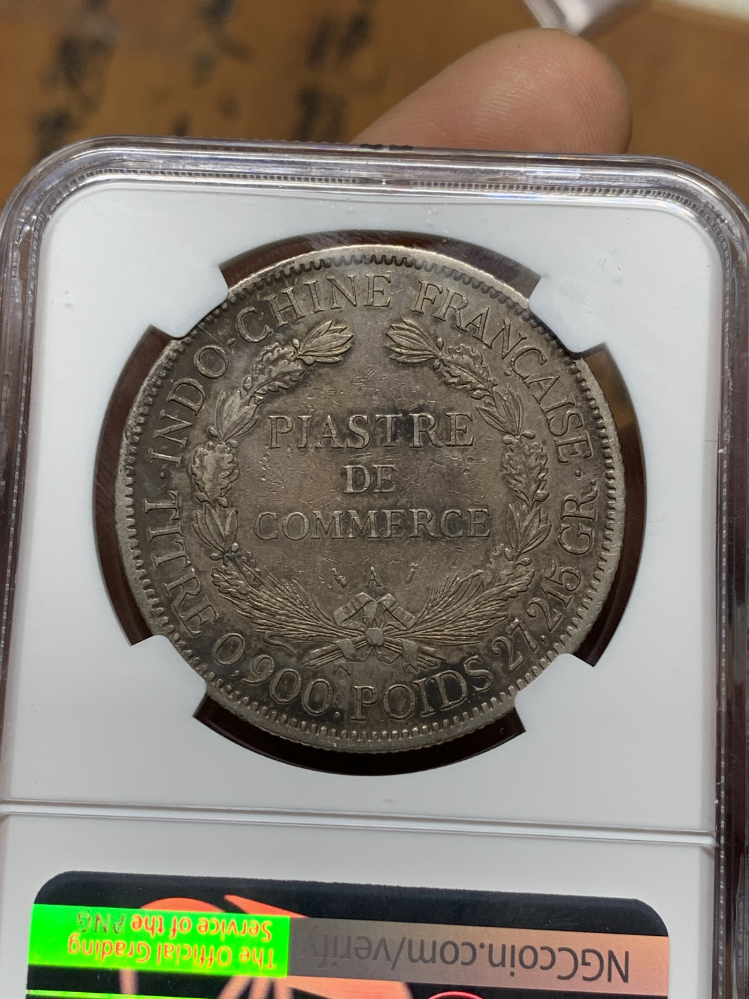 《竞宝斋》第31场（年内尾拍）-周日，周一，周二3场连拍（全场顺丰包邮） NGC 评级 深黑发财包浆 法属印支 1894年加重坐人 银币 鼻尖磨损 整体保存的很好