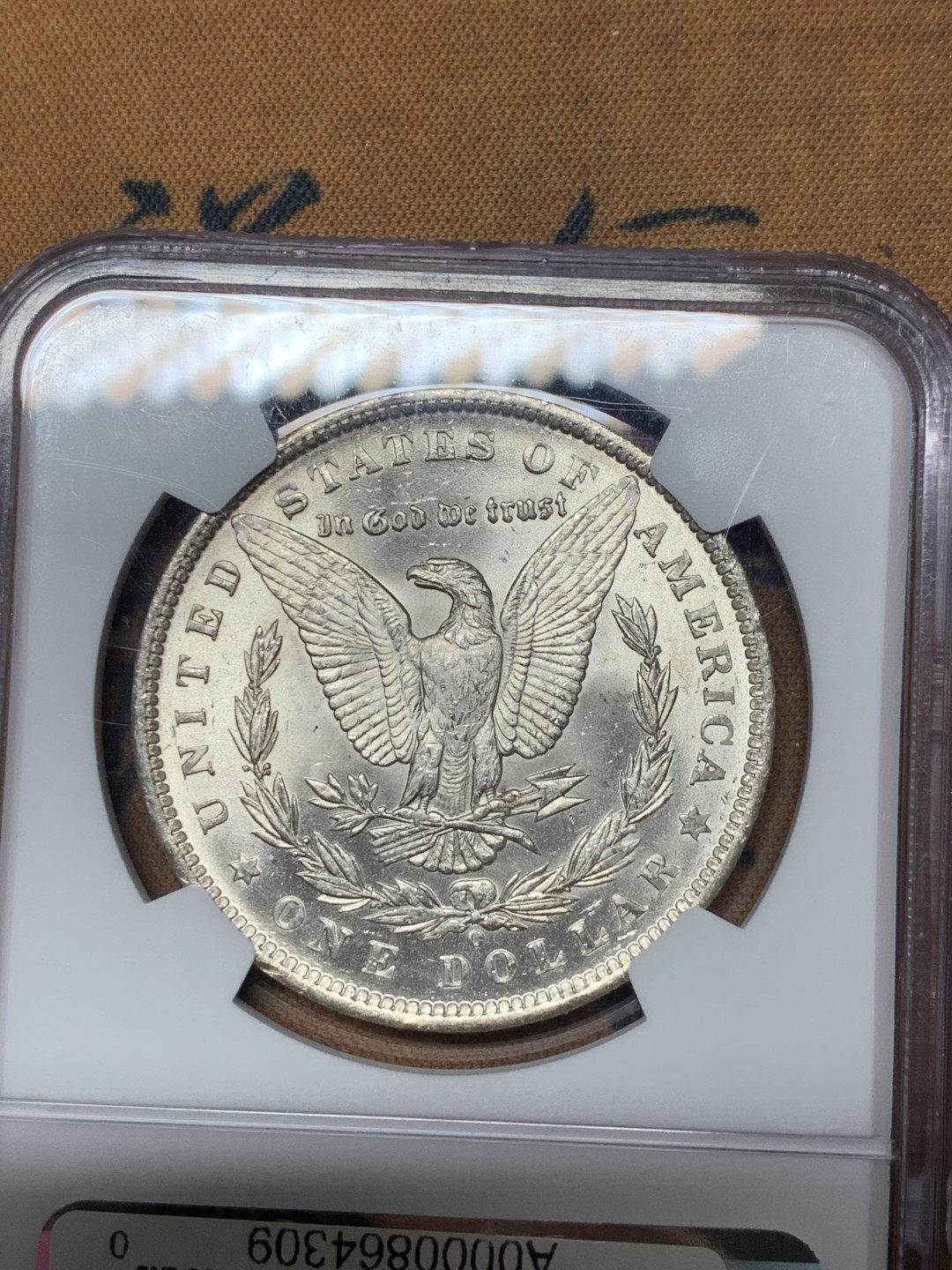 《竞宝斋》第31场（年内尾拍）-周日，周一，周二3场连拍（全场顺丰包邮） NGC MS62 美国1890年 摩根银元 带CAC认证标志，深彩月牙包浆 整体非常漂亮