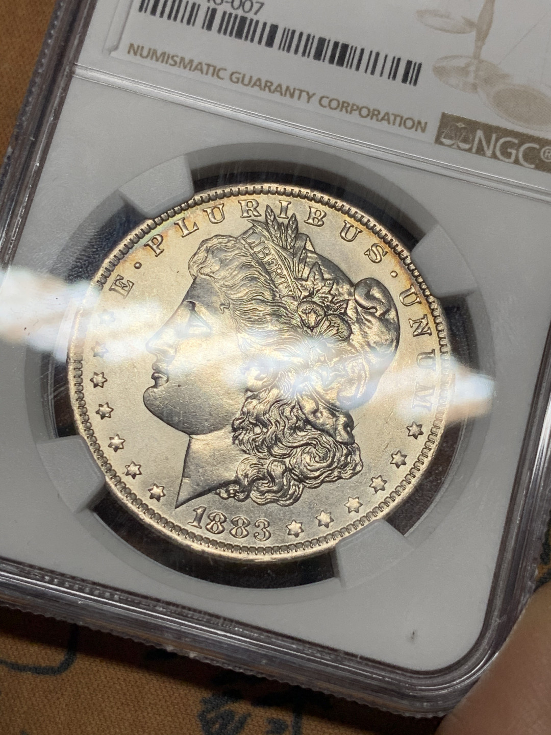 《竞宝斋》第31场（年内尾拍）-周日，周一，周二3场连拍（全场顺丰包邮） NGC-UNCD 美国 1883年 1元 摩根银币 透打