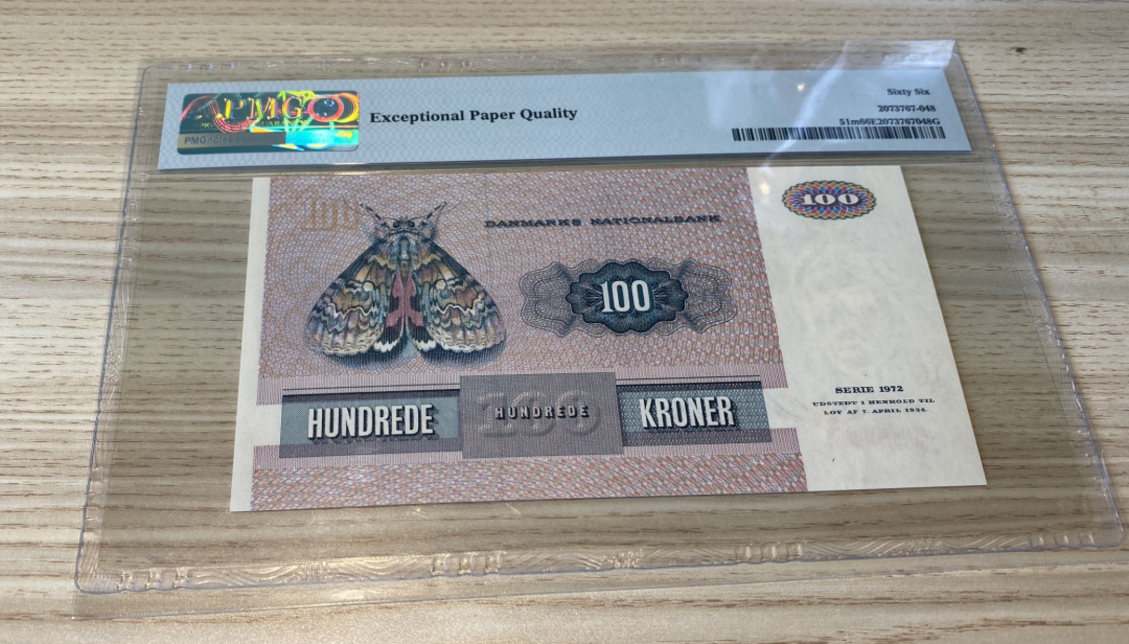 Chase Auction 第1期 - -世界纸币精萃 1985年丹麦100克朗，PMG66分，画家延斯尤尔！精美大蛾子！