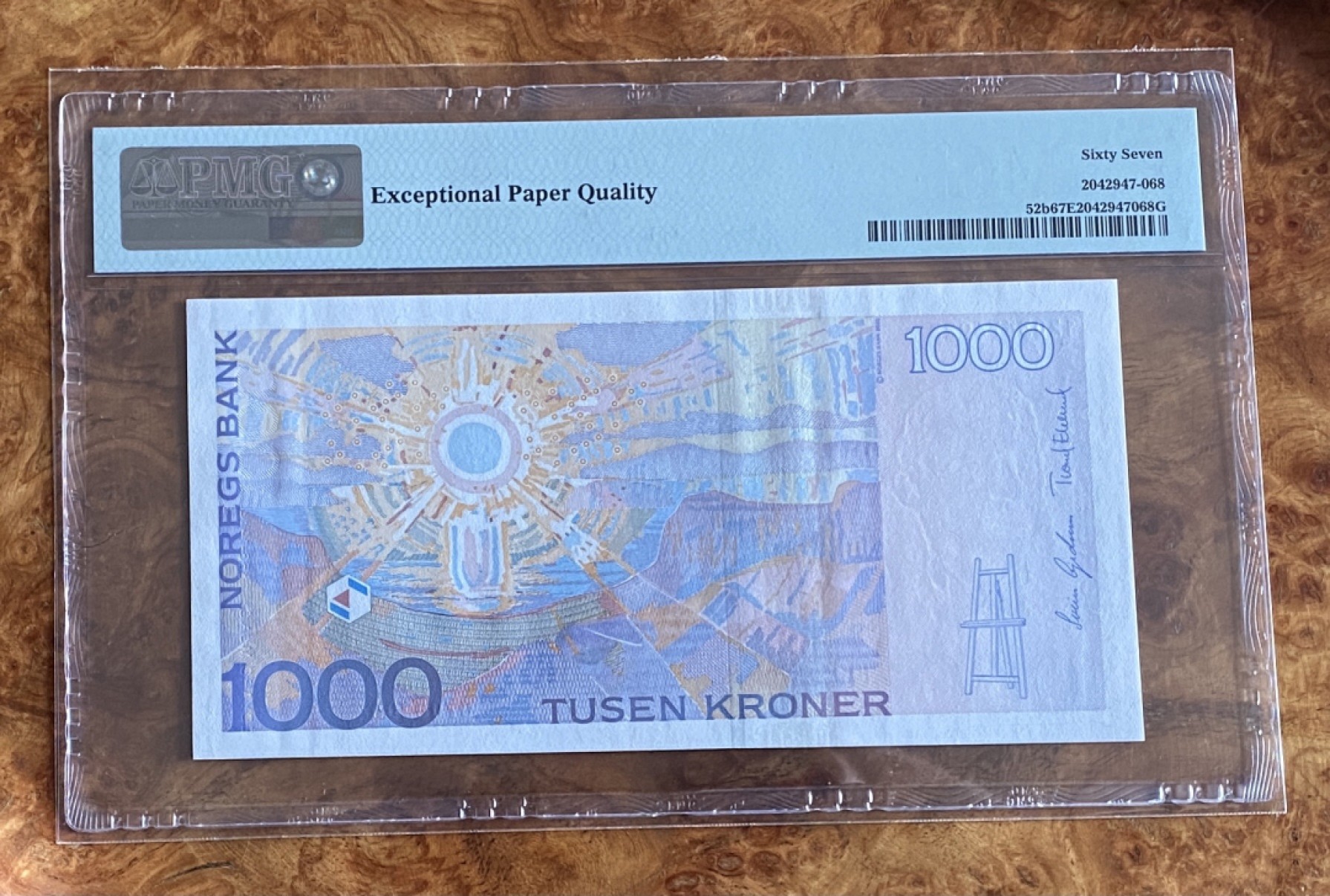 得物拍卖 Chase Auction  第2期 - -世界纸币精粹（二） 2004年挪威1000克朗，PMG67分，表现主义画家蒙克，代表作《呐喊》，背面为其作品《太阳》！