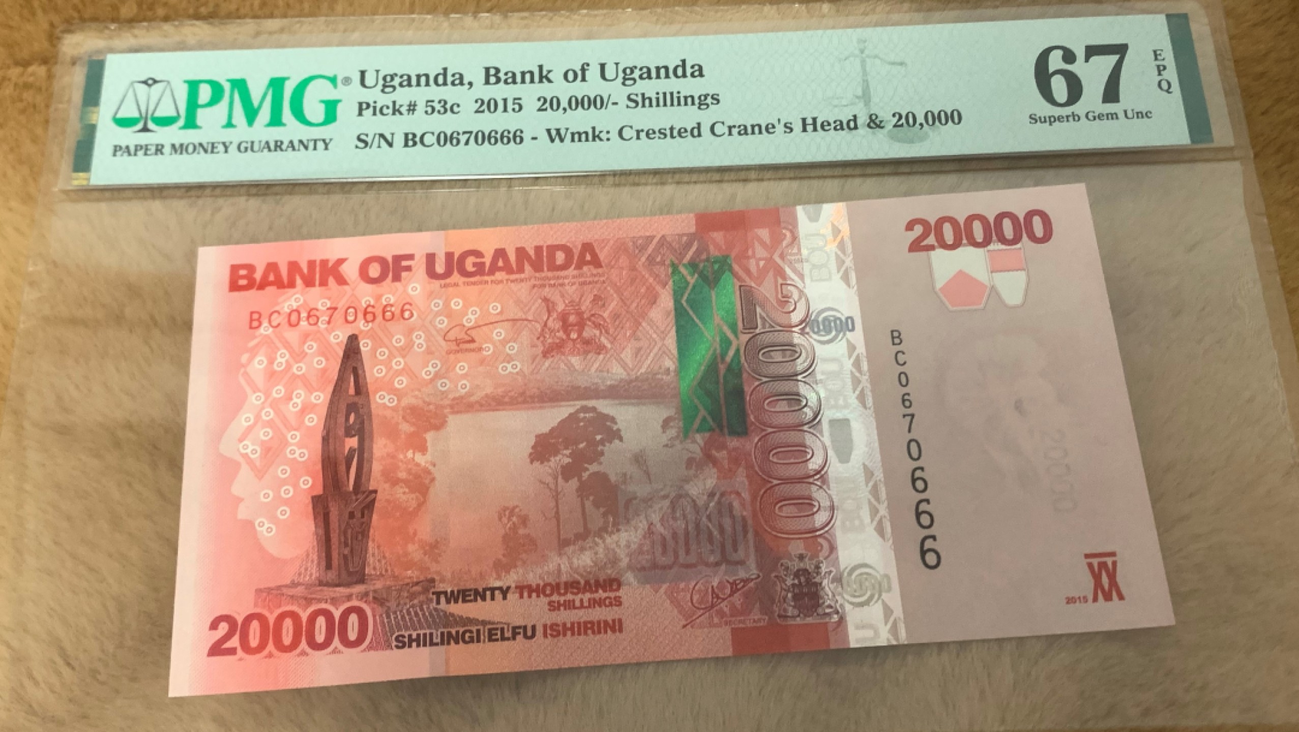 圣域骑士团 | 虎年新春上元节 专场 第二期（2022002期） 2015年 乌干达 20000先令 PMG67分 P53c  豹子号666 BC0670666