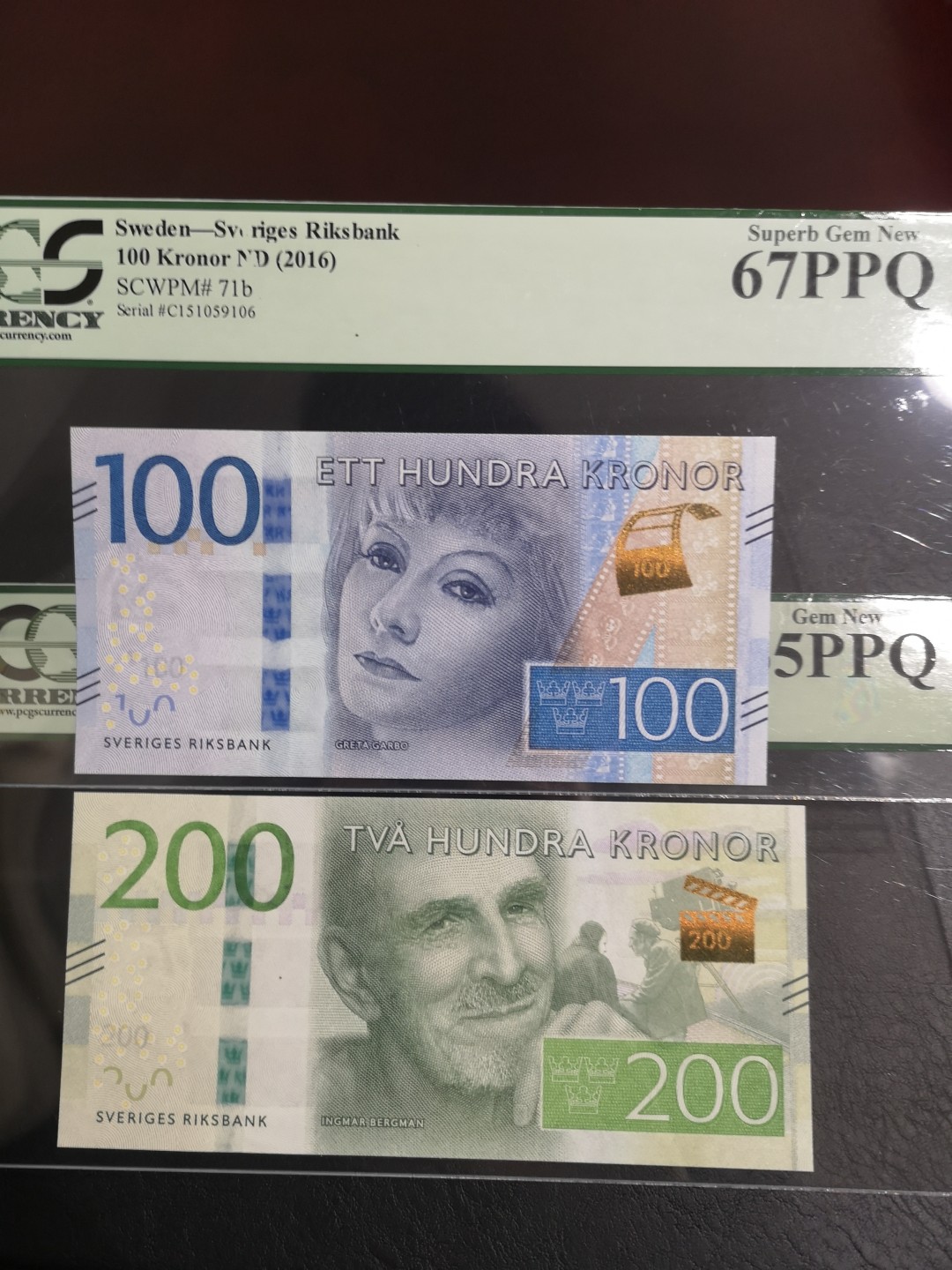 《外钞收藏家》第一百六十五期拍卖（本期80件） 瑞典最新版100、200克朗 两张一起 PCGS绿标