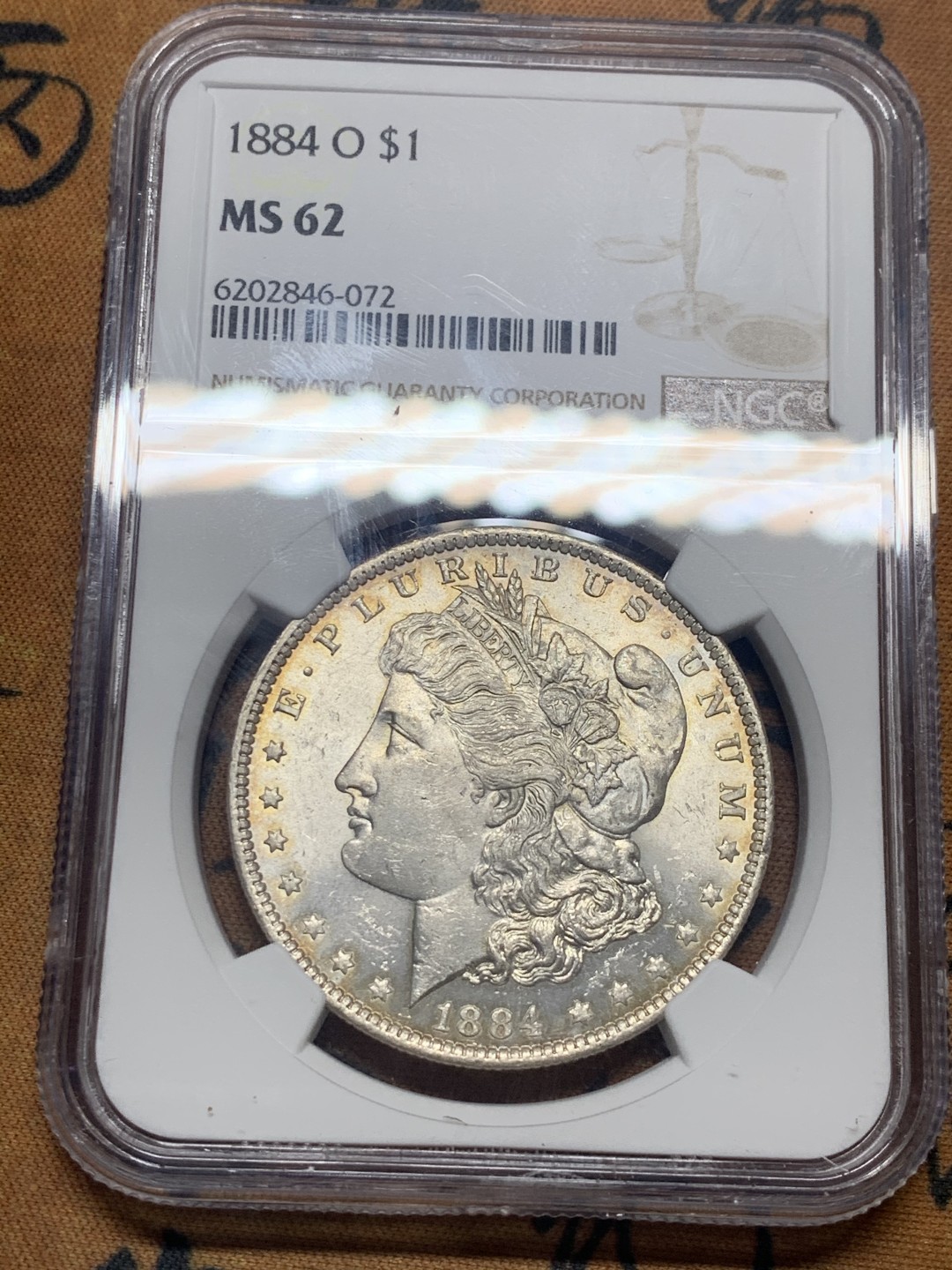 《竞宝斋》微拍-第32场-周日（全场顺丰包邮） NGC-MS62 美国 1884年 1元 摩根银币 双面淡彩包浆