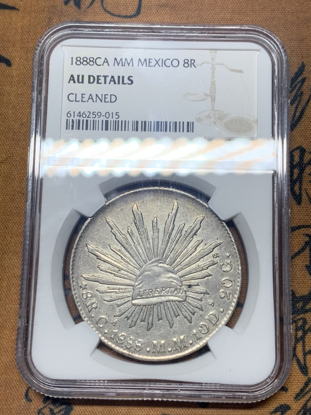 《竞宝斋》微拍-第32场-周日（全场顺丰包邮） NGC-AUD   墨西哥 1888年 8 里亚尔   奇瓦瓦厂  银币     原味带彩CA厂老鹰 吉祥年份