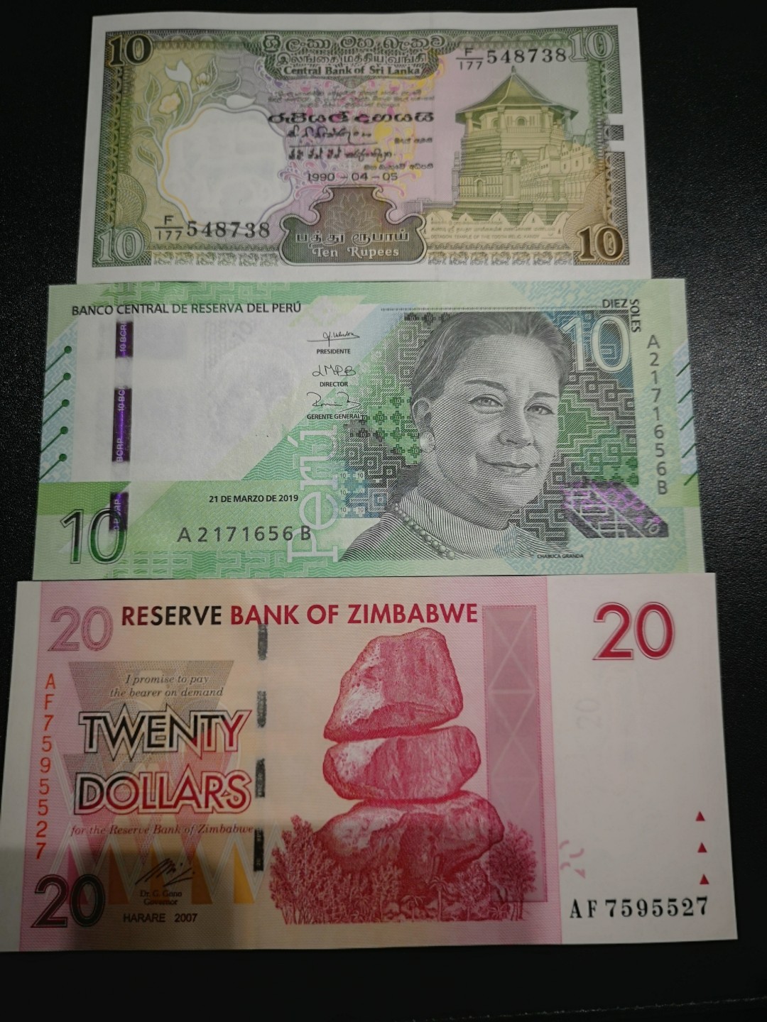 《外钞收藏家》第一百六十六期拍卖（本期89件） 斯里兰卡90年10、秘鲁2019年10索尔、20津巴布韦 三张一起 全新 斯里兰轻微潮