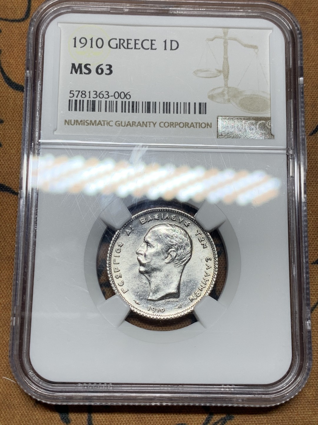 《竞宝斋》第34，35场-本周日，周一2场连拍（全场顺丰包邮） 1910年希腊1德拉克马银币 MS63 原光品相 细节完美 背面独具朦胧艺术感 盾牌上人脸细节清晰 之前61分成交1200+