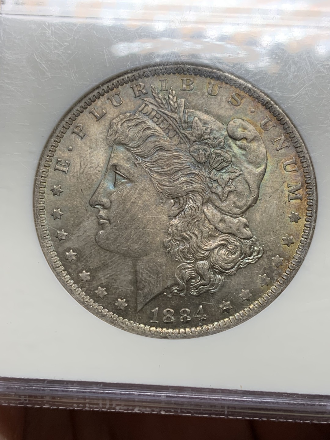 《竞宝斋》第36场-本周日 （全场顺丰包邮） NGC-MS64美国1884年摩根银币 NGC老盒严评，淡五彩包浆