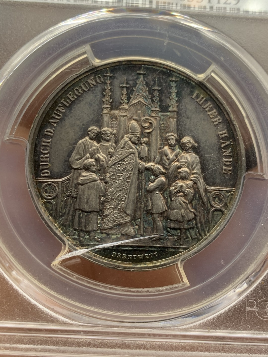 《竞宝斋》第36场-本周日 （全场顺丰包邮） pcgs-sp63 1850年德国奥格斯堡天主教洗礼银样章 双面紫罗兰镜面五彩 雕刻精细 冠军分 实物观感极佳 奥格斯堡建于公元前15年罗马皇帝奥古斯都时代 著名的文艺复兴之都 莫扎特的故居 盒子正面有小裂