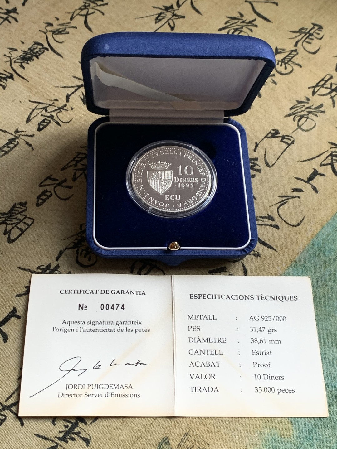 《竞宝斋》第37场-周日 首场自动拍卖 2件或者满200包顺丰 原蓝盒证书安道尔1995年神的羔羊10第纳尔精制大银币31.47克