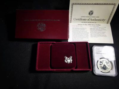 刘世昌艺术品销售中心～虎踞龙蟠*金杨在线联拍群第306期  - 美国1988年1美元“汉城奥运会.五环和花环”精制纪念银币（NGC PF65UC 串号：6412532-023）1枚，原盒证。此币荣获当年世界硬币大奖赛～“最受欢迎币”奖。注：评级币盒子有裂痕。