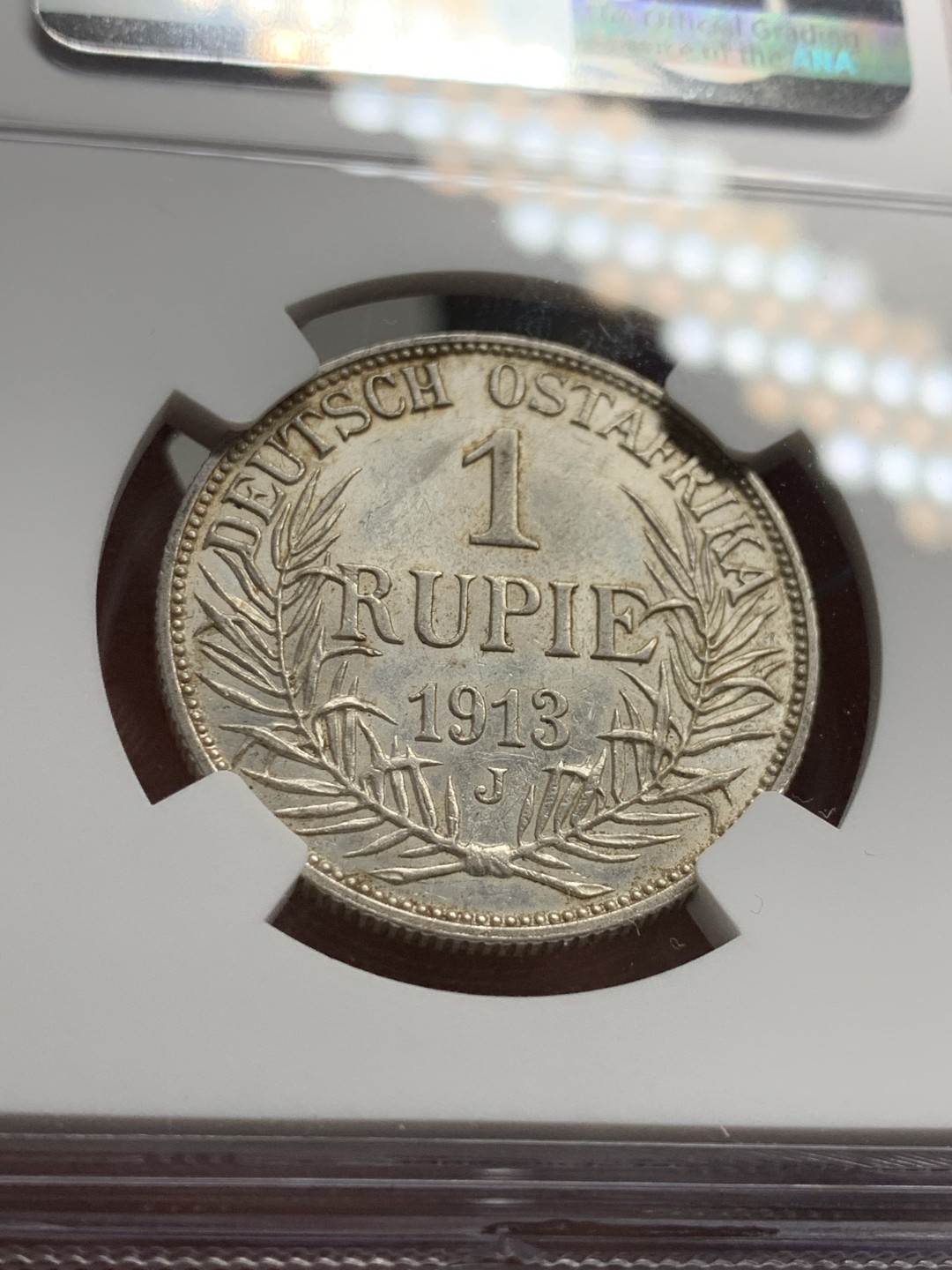 《竞宝斋》第38场-本周一 （全场顺丰包邮） 1913年 NGC UNC德属东非1卢比银币 细节保存的很好 带包浆